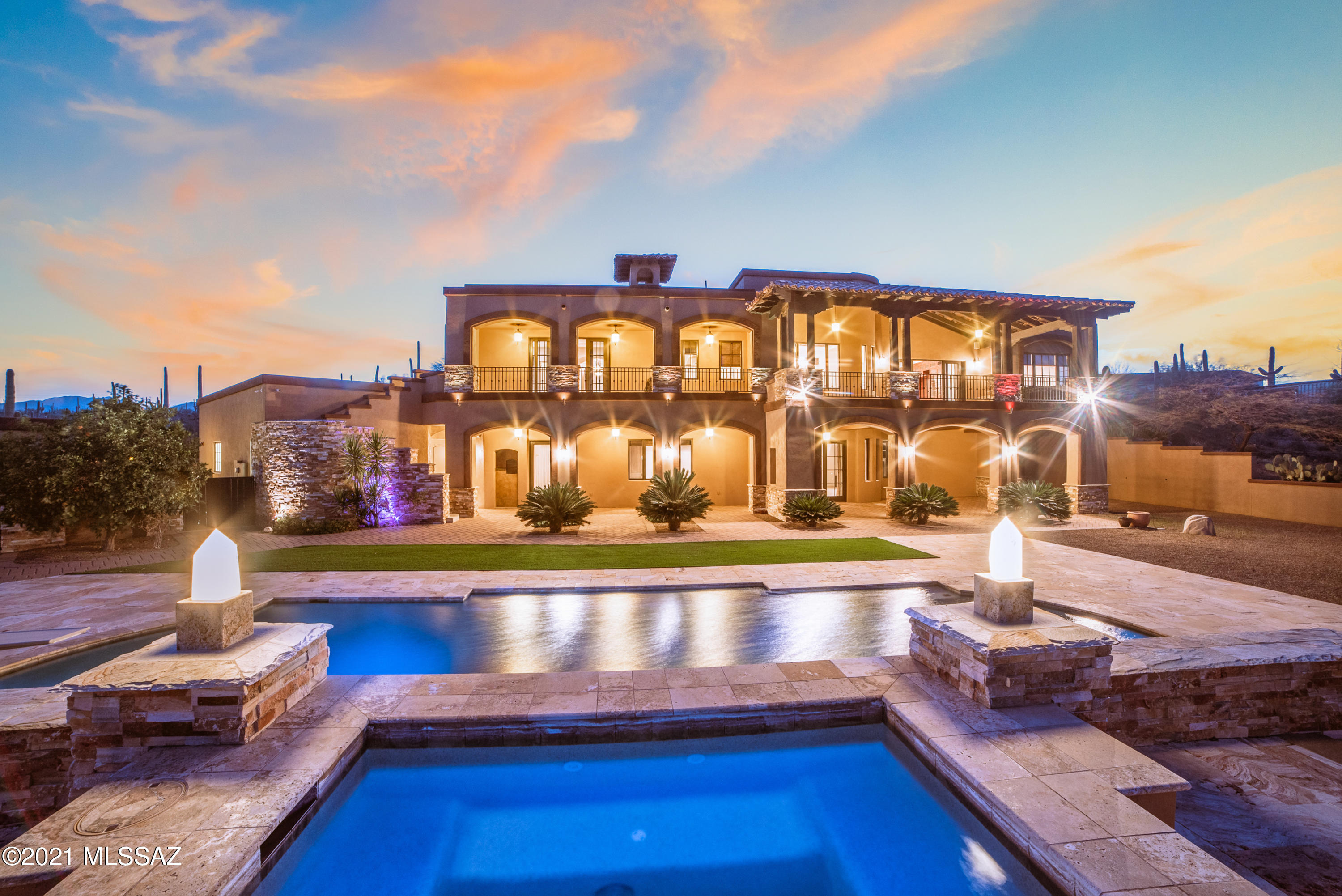 The house on the hill. Unparalleled from its rivals. As you make your way up the driveway, your own piece of paradise comes into focus. There is no shortage of privacy, majesty or exclusivity on your 3.3 acre estate, abutting onto Saguaro National Park. 

Upon entering, you will be greeted by a grand foyer with newly installed marble floors. Make your way to the entertainment area, nicely appointed with a full bar, and perfectly set up for a pool table, formal dining, or anything else your heart desires. This spacious area also boasts its own private bedroom with en-suite bathroom, and separate, dedicated office space.

Step outside and you will be taken back by peak to peak views of the Santa Catalina mountains, unmatched views of the Tucson valley, and so much more. Take a dip in your heated pool or spa and while away your days in tranquility.

Make your way up the newly finished interior stairs (or take the elevator) to the second wing of your home, featuring a gourmet chef's kitchen, additional bedrooms, plenty of living and entertaining spaces, and your very private master bedroom, outfitted with a palatial bathroom, and a double sided fireplace for those cooler desert nights. 

Take further advantage of those amazing views from the upstairs balcony spanning the entire upper floor of the house. Your 180 degree views let you enjoy the sunrise over the Rincons, and sunset over the Tucson Mountains. At night, the city lights twinkle in the distance. 

The four car garage also gives you plenty of room for your vehicles and toys! 

Come see what makes this home so special, and make it yours.