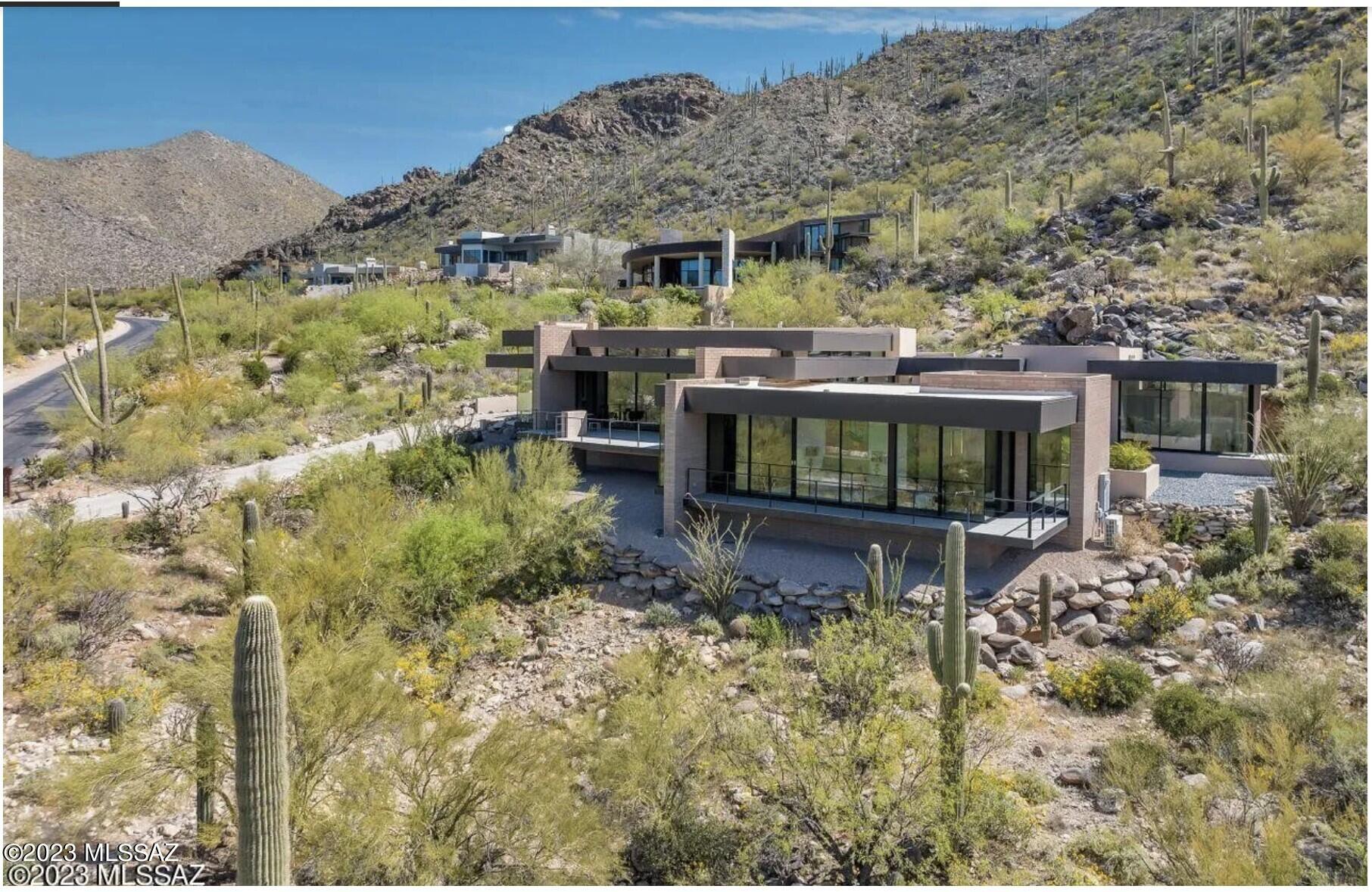 Come feast your eyes on the pinnacle of modernist architectural design in Canyon Pass, overlooking the 5th fairway of the Gallery North Course.This newly-built home, designed by Serghei Sari Terzi combines luxury living, comfort, & cutting edge design. The craftsmanship, custom finishes, cantilevering patios & living areas are a must see. Masonry construction w/exposed architectural block detail, large format porcelain tile thru-out, including outdoor living areas. Fleetwood thermally broken, insulated, low E windows & doors w/fully pocketing patio sliding doors. Integrated appliances w/ wine storage, grain-matched, quarter-sawn walnut cabinetry, doors & closets. Rocas Azul limestone baths & outdoor shower. Detached guest house w/morning kitchen. Three oversized outdoor living areas create