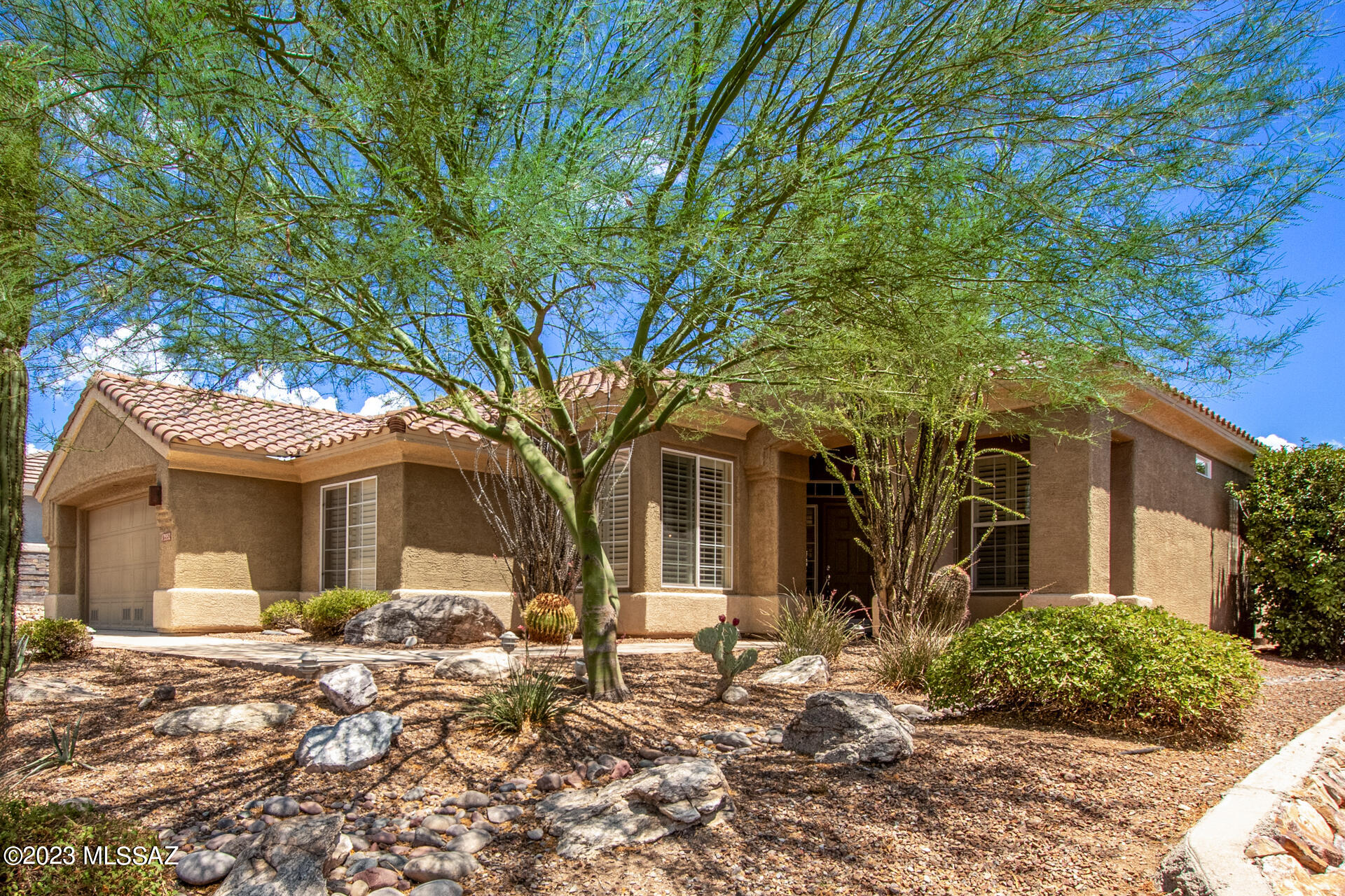 Well appointed Whetstone/Tahoe model. Tranquil backyard oasis with extensive flagstone patio, multiple sitting areas, gas fireplace, BBQ, sweeping panoramic views of mountains, 17th tee box, ,Arthurs Hill, city lights and glowing sunrises. Plantation shutters throughout and 2 large skylights in the living room  allowing natural sunlight to light up the house!   Kitchen is an entertainer's delight with double ovens, SS appliances, garden sink, gas cooktop, under counter lighting, cabinets galore, pendant lighting, and marble countertops. Sprawling Primary  bedroom including a private retreat area    with  built in  entertainment  center.  Generous sized 2nd bedroom with  bay window. Large formal dining room for  your entertaining pleasure.  Roof replaced 2021, New a/c 2022. Many wonderful  features set this home apart from the rest! Eat in Kitchen with bay window, Oversized  family room. Remodeled Master bath has a walk -in shower and vanity with  dual sinks. Central vac, water softener and so much more.    Abundant storage throughout the home with additional attic space in garage,  garage cabinets and storage, utility room with desk, and  loads of cabinets. Most furnishings are available too!  This is a home you will not want to miss in the premiere gated active adult community. Highlands at Dove Mountain!  Resort style living including golf, tennis, pickleball, fitness center,  restaurant and bar, many clubs and activities and so much more. Down the road form the Ritz Carlton Dove Mountain and near many biking and hiking trails.  Call for your private showing.