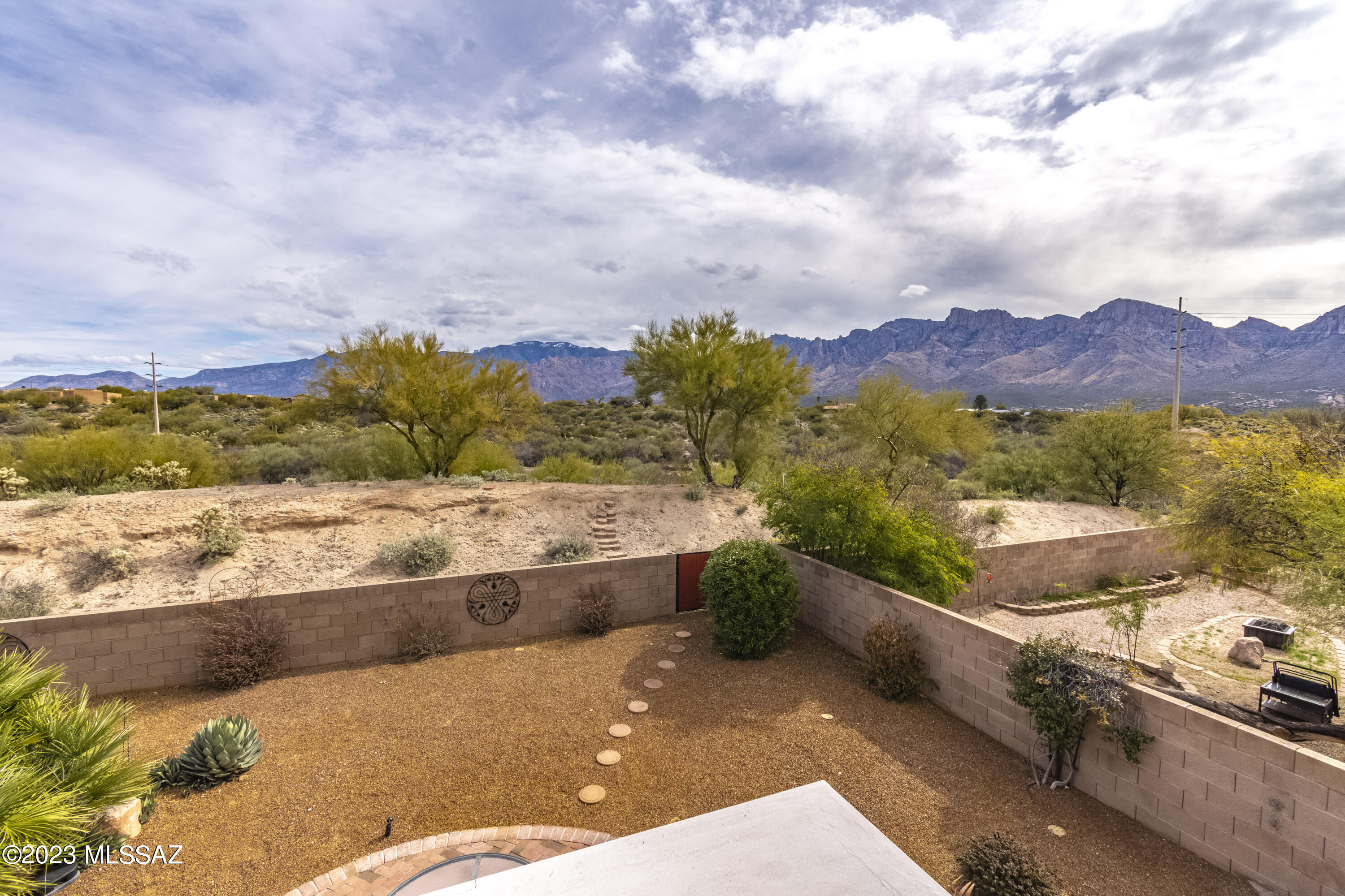 Move in ready AF Sterling 2 story in sought-after Monterra Hills!  4 bedroom, 3 baths with one full bath and bed on ground floor.  Versatile plan with kitchen/great room as well as formal dining and living areas. No poly pipes, reverse osmosis in kitchen.
Enjoy an outdoor living lifestyle with unobstructed mountain views of Pusch Ridge, roomy back yard fully fenced and front courtyard as well! All enhanced with lovely flagstone walkways and additional pavers.  Citrus trees, BBQ area, planting beds, and other mature landscaping add to the appeal. In addition, owned solar!
See the attached features list for more characteristics of the home. Deep cleaned interior plus professional carpet care add to the easy move-in environment.  Call or Text to see!