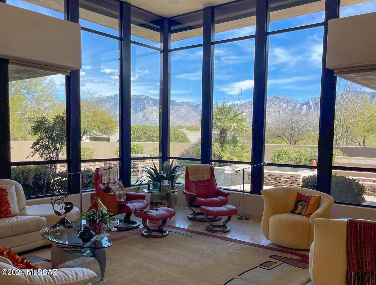 Once in a great while a home stands out as a truly special place.  From the moment you walk through the door you will be wowed by the Catalina Mountain views captured out the floor to ceiling windows.  Home has a soft Contemporary style that was perfectly sited to allow for privacy and views from every room.  Great room concept with gorgeous fireplace, beautiful kitchen, split bedrooms, high ceilings throughout and lots of stone accents.  The truly wonderful outdoor living with various covered patio areas, firepit with built in banco seating, outdoor BBQ with sit up bar and custom salt chlorinator pool/spa with cleaning system, plumbed for solar, that blends seamlessly with the home's contemporary architecture.  
 This home is not to be missed.  (Professional photos soon)