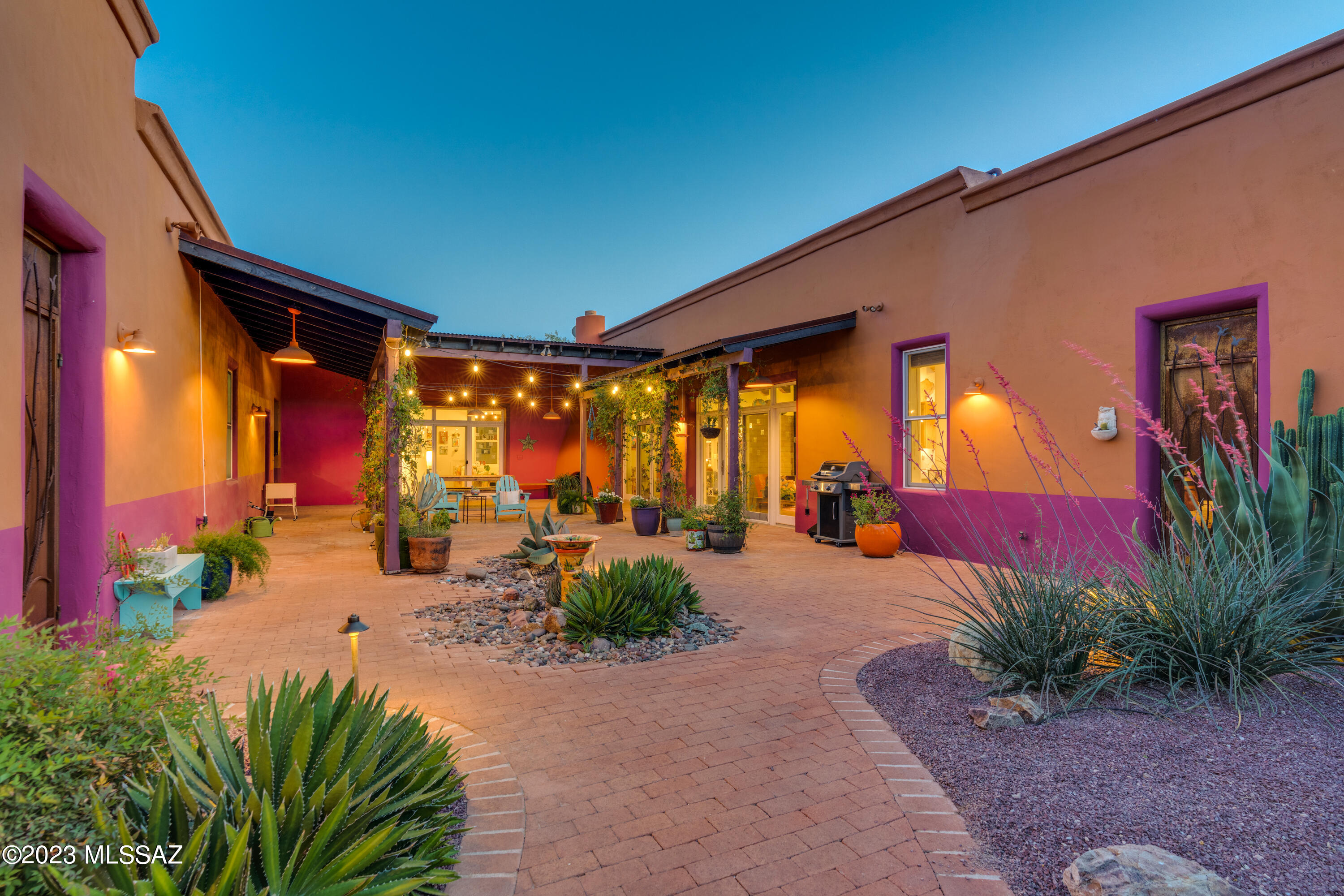 Looking for character and originality combined with contemporary amenities and comforts? Look no further! This private, custom-built, luxury hacienda on over 3 acres is among the most unique homes in Tucson. The house was built using rammed earth technology to achieve one of a kind design and outstanding insulating quality. Gorgeous courtyard will welcome you with wrought iron gates, corrugated metal awnings, brick paved flooring, luscious greenery and beehive gas fireplace. The interior has concrete floors, plaster walls, high ceilings, exquisite large windows, impressive exposed beams and surround sound throughout. Kitchen boasts state of the art appliances, large island, quartz counters, Alder cabinets, walk-in pantry and a gas fireplace. Spacious master suite with access to courtyard and backyard features spectacular walk-in, indoor / outdoor shower and double vanity. Main house has 2 bedrooms / 2 bathrooms + den. 1 bedroom / 1 bathroom casita located across the courtyard will make the most discriminating guests happy and has a great potential to generate additional income. Tree-lined concrete driveway leads from the street all the way to an oversized 2 car garage. Private backyard oasis with large PebbleTec pool and patio is perfect for relaxing or entertaining. Horse facilities include 3 stalls, hay storage, large turnout, round pen and tack room. Professionally built chicken coop is the cherry on top. The property is right across the street from Saguaro National Park and offers unparalleled privacy, serenity, Rincon Mountains views and natural desert beauty. At the same time, the estate is within minutes of restaurants, groceries, shopping and entertainment. Welcome to paradise! 

A complete list of home improvements and floor plan are available in the Documents section of the listing. Casita furniture and Starlink internet equipment are available via separate bill of sale. Casita is a profitable Airbnb. Details available upon request.