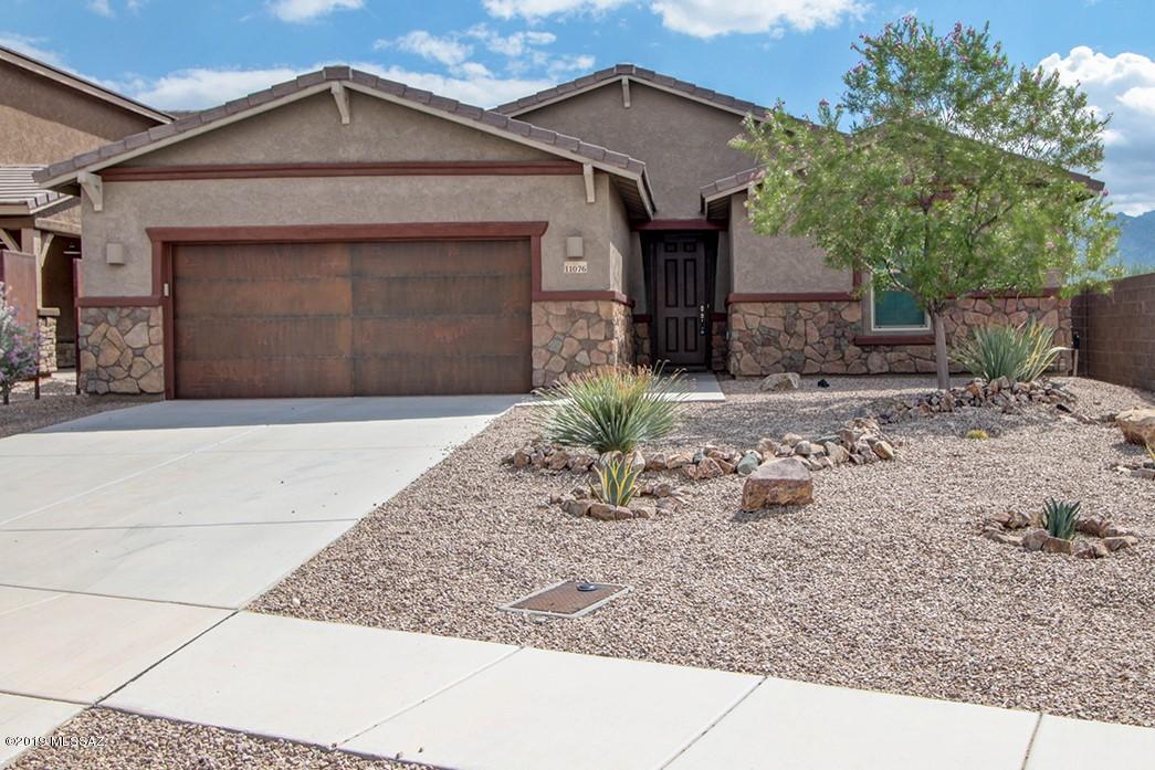 Mountain Views form East facing Backyard.  Home backs to Neighborhood Park.  Well Maintained home in Gated Community. 4 Bedroom, 3 Full baths.  Great Room that Opens to Kitchen. Gourmet kitchen includes: Quartz Counter Tops, Double Ovens, Stainless Steel Appliances, 5 Gas Burner Range top, Custom Tiled Back Splash, Custom Range Hood and Modern White Cabinets.  Large Walk in Pantry w/pull outs.  Butler area includes wine Fridge. Contemporary lighting and fans through home.  Real Wood flooring in bedrooms.  Large wood like tiled flooring.  Master Suite includes 2 Walk In Closets with custom built ins.  Master Bath has 2 different separate  Quartz , Vanities, Large Walk in Shower with Rain Shower Head.  Extended Brick paved patio, Gas Fire Pit and Gas BBQ, Fruit Trees, Garden Area and Turf.