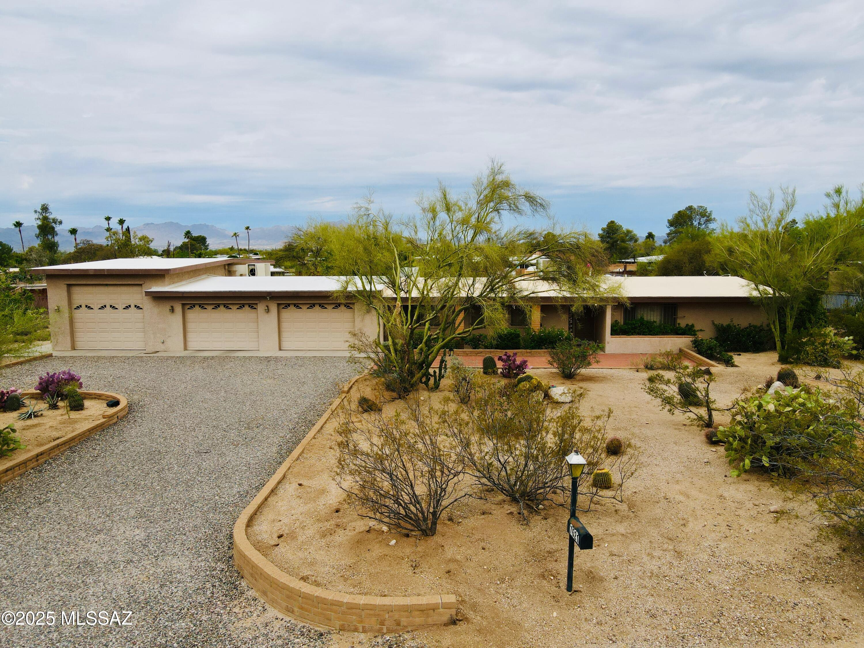 Beautiful North Tucson Home on Nearly an Acre with Stunning Views and No HOA—Ideal for Car Enthusiasts!

This charming 4-bedroom home in Casa Adobe West offers breathtaking Catalina Mountain views on a nearly one-acre lot—perfect for outdoor living, gardening, or expansion. Located in peaceful northwest Tucson, it provides privacy, versatility, and room to grow.

Built in 1983 and well-maintained, the home features a bright kitchen with bone color cabinets, granite countertops, and a skylight. The backyard boasts a Pebble Tec pool, extended covered patio, mature shade trees, and a natural grass area enclosed by brick walls—great for relaxation and entertaining.

The property includes a large, expanded garage capable of accommodating multiple vehicles, lifts (10ft door), and ample storage perfect for car enthusiasts. Without an HOA, you have the freedom to customize and expand as you wish.

Conveniently located near top schools, parks, shopping, and dining along Oracle Road, this property offers tranquility and easy access to Tucson's amenities. The spacious lot is ideal for outdoor projects, RV parking, or a workshop.

Don't miss this versatile, scenic property with incredible views and ample space schedule your private tour today!