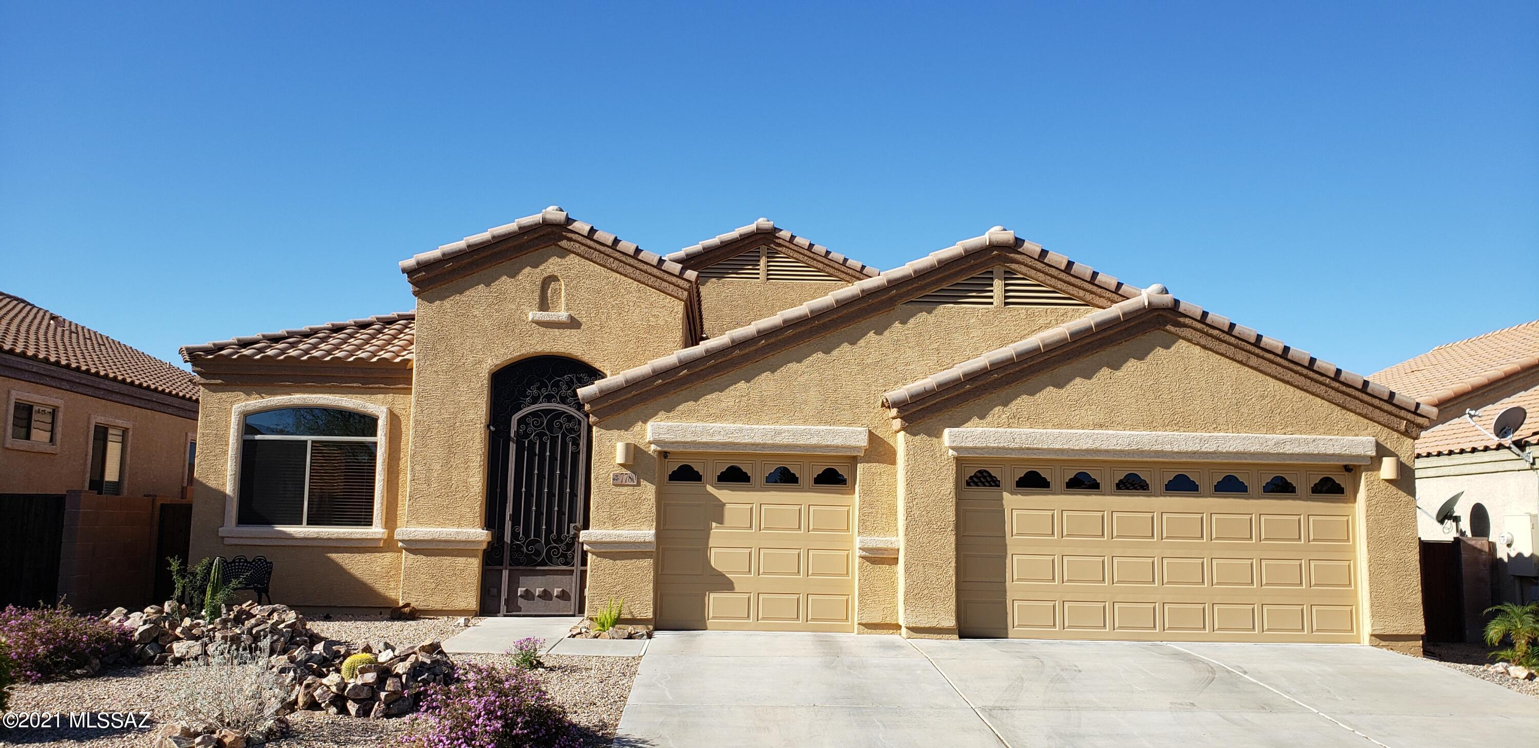 Open & spacious 3RB/2BA 3 car garage TEP Guaranty home with self cleaning salt water POOL! Custom front gate entry to home with 10' ceilings! Front formal Living Room & Dining Room; Open kitchen w/breakfast bar/desk/island/granite counters/stainless steel appliances , whole house water softener, reverse osmosis at kitchen sink, dining nook! Family room off kitchen. Split bedroom plan: Master bath has garden tub, separate shower, dual sink vanity & walk-in closet! Back patio includes covered patio; Pebble Tec salt water pool w/pop-up cleaners & fencing; pavers and beautiful artificial turf surround pool.  Malibu style lighting in back with drip systems in front and rear yards.  Beautiful plants.  electrical added in back yard as well. 3 car garage Vail schools! new AC / Heat Pump in 2019