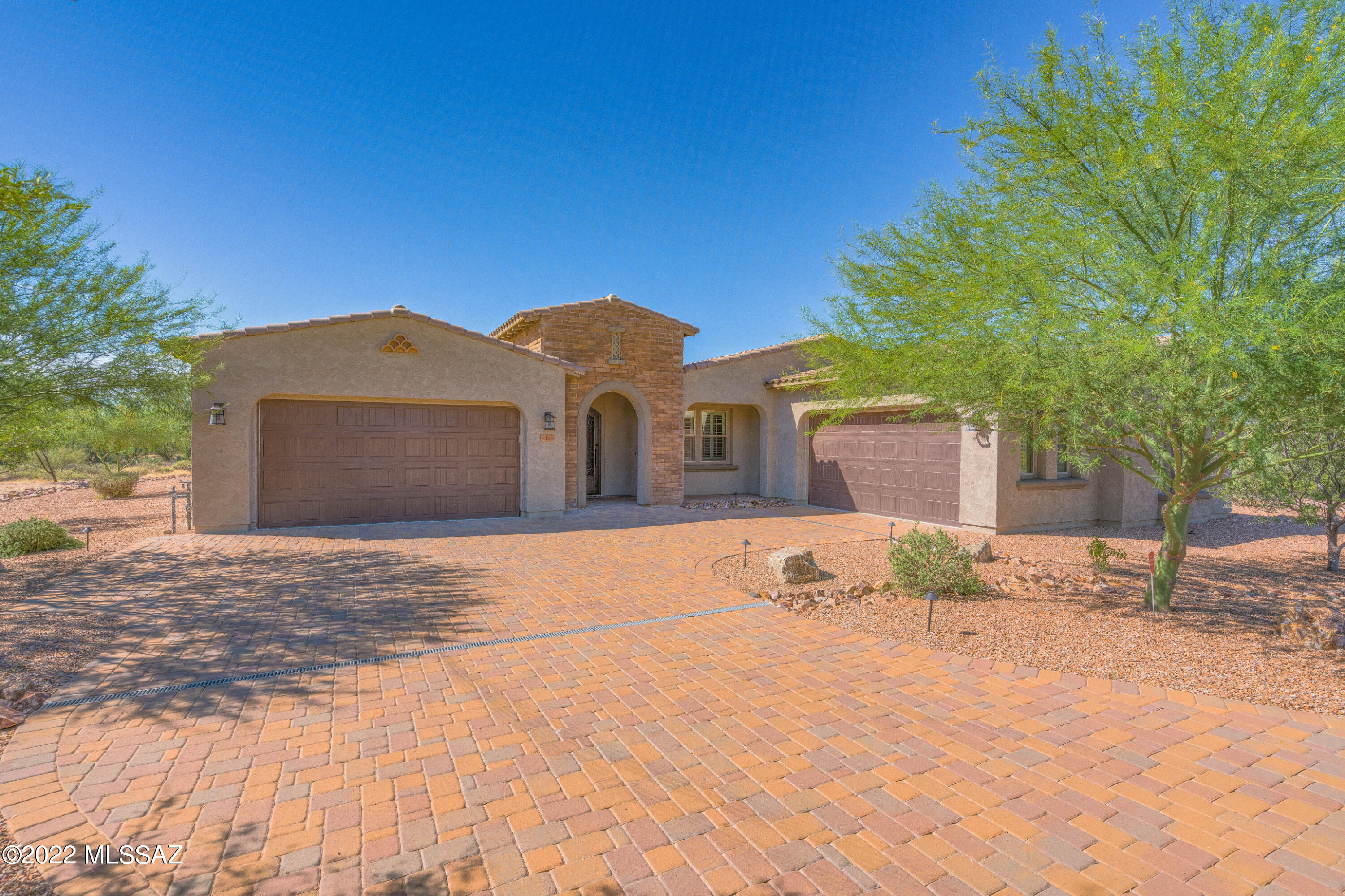 Amazing 3756 SQ.FT. executive home with 4 car garage on 1.3 acres located in the prestigious gated community of Tortolita Vistas near Dove Mountain. All homes in this community are single story with large home sites. This home features 5 bedrooms (including den) plus a media rm. Upgraded shutters throughout, a gourmet kitchen with stainless steel appliances,double oven & soft close drawers. The kitchen, baths & laundry all have granite. 10 ft ceilings, 12 ft multi-slider glass door in great rm. Tile flooring in all traffic areas.  Custom front door. Long pavered driveway. 2 x exterior walls.  Professionally landscaped front & back, true 4 car garage (2 doubles), paver covered patio in backyard with built in grill,backs to acres of desert to the side & behind plus panoramic mountain views