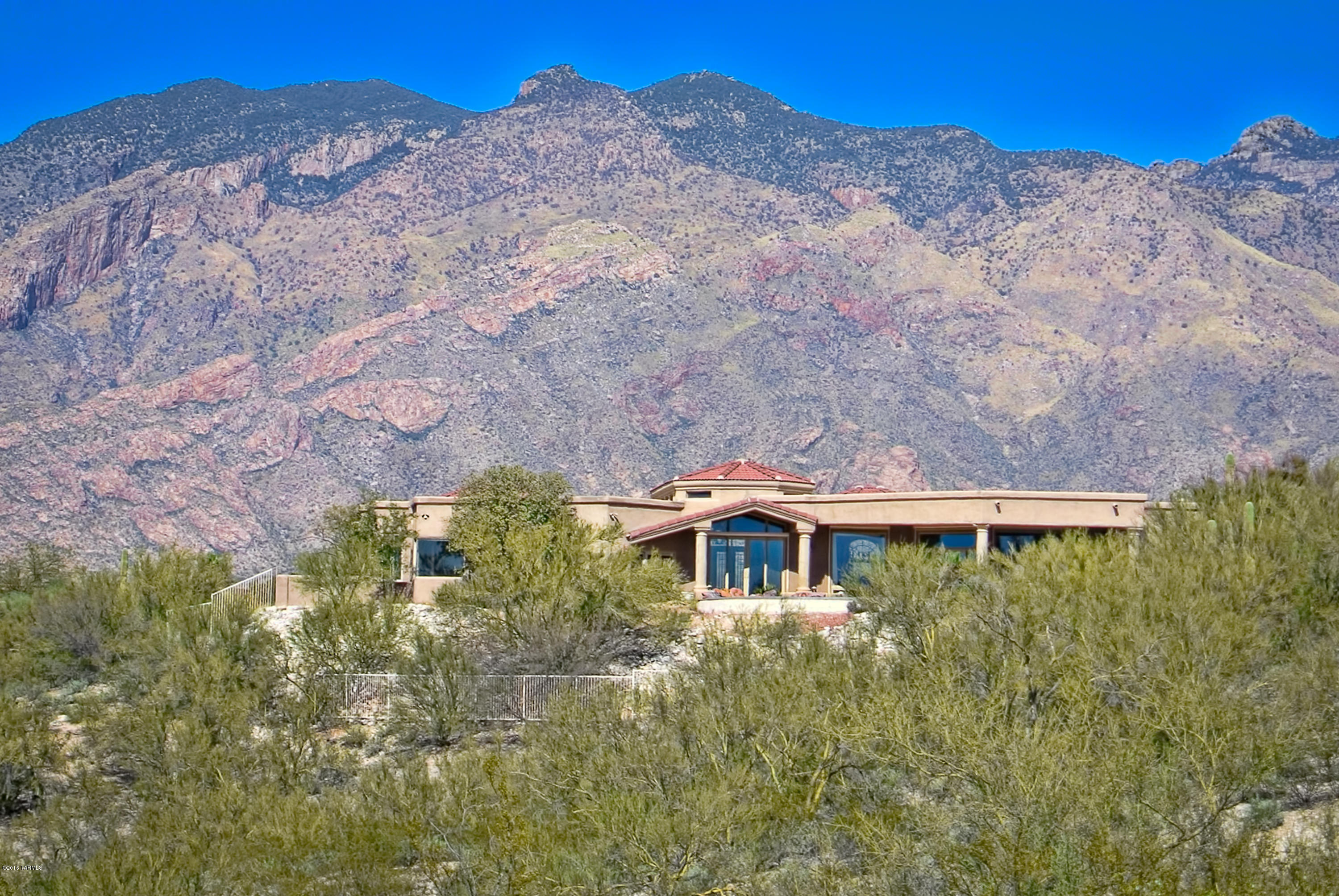 1.25 Acre Hilltop Home With 360 Degree Mountain and City Views. This 5 Br Plus Executive Office and Den Features 16' Ceilings, Wall of Windows, Formal Dining, Elegant Living Room,  Gourmet Kitchen with Granite Counters and Island. Great Open Floorplan with 4 Br Wing On One Side and Master Suite, Den and Executive Office On the Other Side. Views with Privacy from Every Window. Fabulous Backyard Features Negative Edge Pool, Spa, 2 Waterfalls, Outdoor BBQ Area, Dog Run and Synthetic Grass Areas, 3 Car Garage, Gated Community. Mike Stoop's Former Residence.