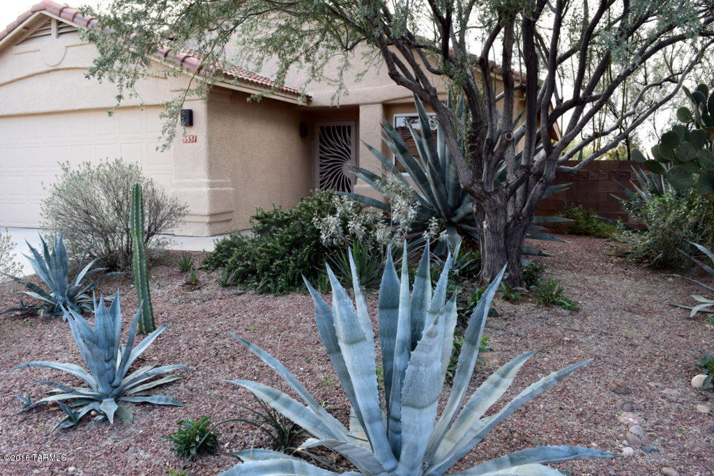 Impeccably maintained home in desirable Dove Mountain Quail Crossing.  Features Include:  Professional Faux painting, Extended Covered Patio with Upgraded French Door, Wood Blinds, Architectural Features/Niches, Mature Landscaping (shade), Upgraded Lighting, Custom Front Security Door, Fruit Tree, Irrigation Front/Back, Ceiling Fans every room, Solar Tube Lighting, Solar Screens (West/East side), Stucco and Painted backyard brick wall, Raised Garden (with shade cover).  All appliances included along with backyard patio table and chairs. Common area behind house allows unobstructed views of gorgeous sunsets.  Offer, Acceptance, Close!!!