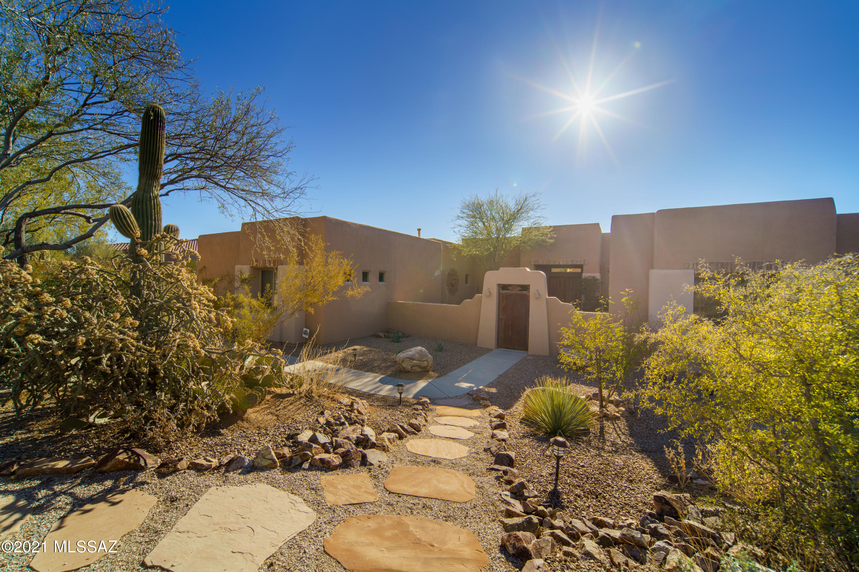 Sought after gated Dos Lagos on almost 1 acre. Walled & gated courtyard welcomes you to this spacious 4BR, 4.5 BA home.  Off the foyer is a secluded den w/double doors & formal dining room.  Open great room, w/ beehive fireplace, large TV niche & windows overlooking the patio.  Kitchen features: breakfast bar, 5 burner gas cooktop on island, display cabs, built in oven & micro, 2 desk areas, wine fridge, pullouts, nook.  Powder room for guests. Separate seating area, could be guest quarters or teen space, w/ 2 bedrooms nearby, both w/en suite baths.  Across the house is another BR, w/bath & the master suite, w/ its patio access, 2 huge walk in closets, dual vanities, soaking tub.  Open & covered patio areas,, pool w/ water feature & hot tub for your enjoyment ! Call for private showing