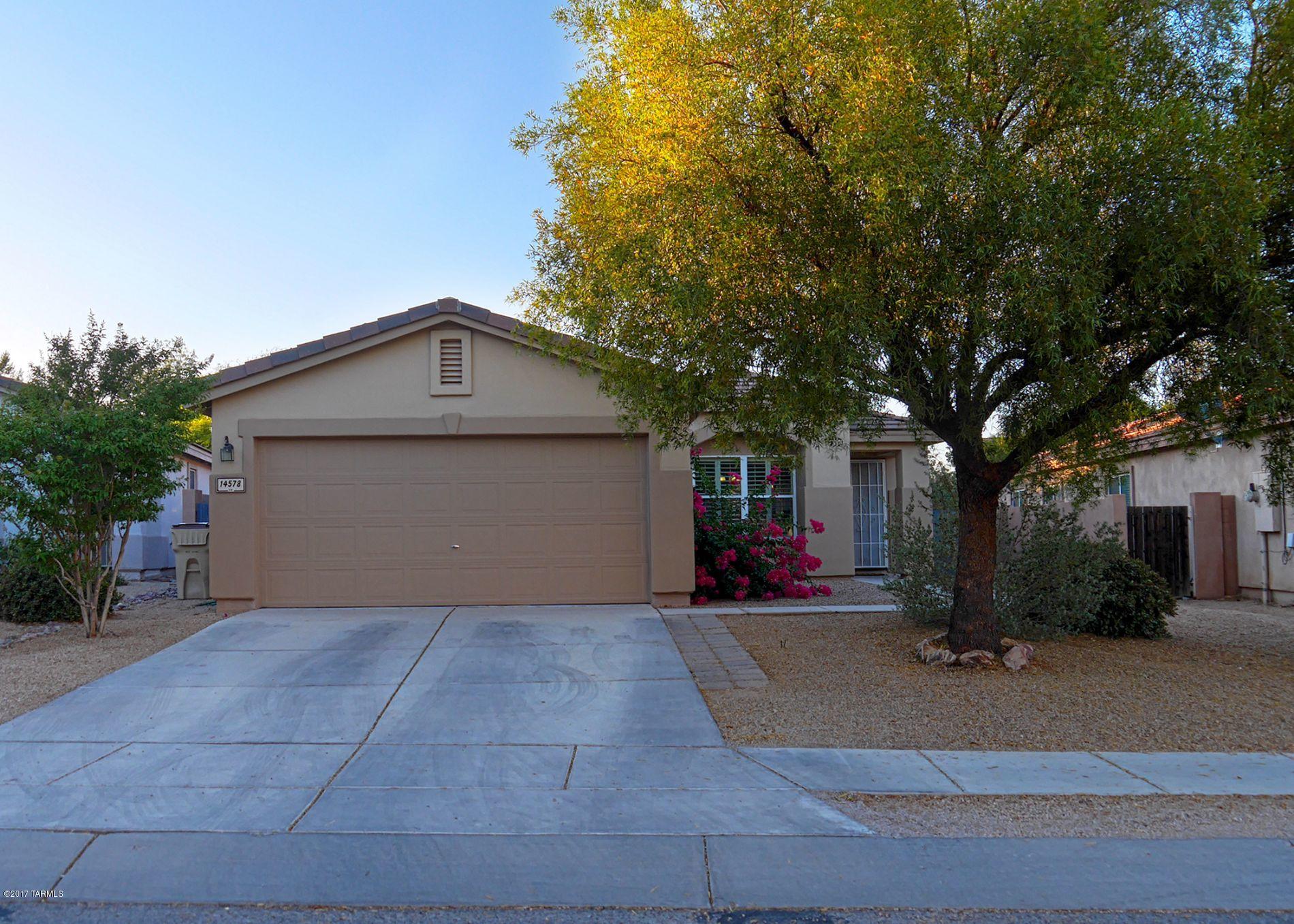 Beautiful single family home located in the sought after and desirable community of Rancho Sahuarita! This 3 bed, 2 bath home features an open floor plan, large family room and a office/bonus room. Tile throughout the house with upgraded carpet in the bedrooms and family room. The backyard features a covered patio and a large paver patio, perfect for outdoor entertaining, and no rear neighbors! This home is just minutes away from all of the amenities this community has to offer including a water park, full gym, shopping and much more!