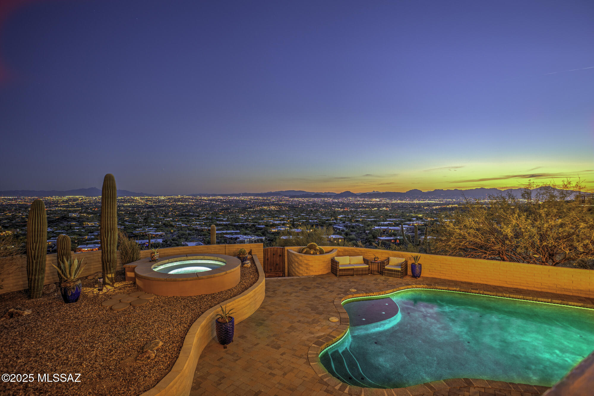''VIEWS, VIEWS, VIEWS! Nestled at the base of the Catalina Mountains with unobstructed panoramic city lights & mountain views, this classic foothills home offers peaceful privacy & one-of-a-kind morning and evening views of the grand fields of Saguaros peppering the slopes of the Catalina Mountains and Canyons. Near hiking trails, the famous Finger Rock formation, and 180° Tucson Valley views. This home has every fine touch finish imaginable! Classic Architecture, travertine tile and solid
Oak flooring, Beamed Ceilings, a Gourmet Kitchen to include custom cabinetry, SS Appliances, Wolf Range with 6 burners and grill, Bosch Dishwasher, Subzero Refrigerator and Wine Cooler, Pella Windows and Doors, Granite Counters and Island with Breakfast Bar. Call, text, or email for Drone Video Link. Outdoor Shower and Sauna! Owned solar with 2 Tesla battery backups! Owner has never had an electric bill since installation of solar system!