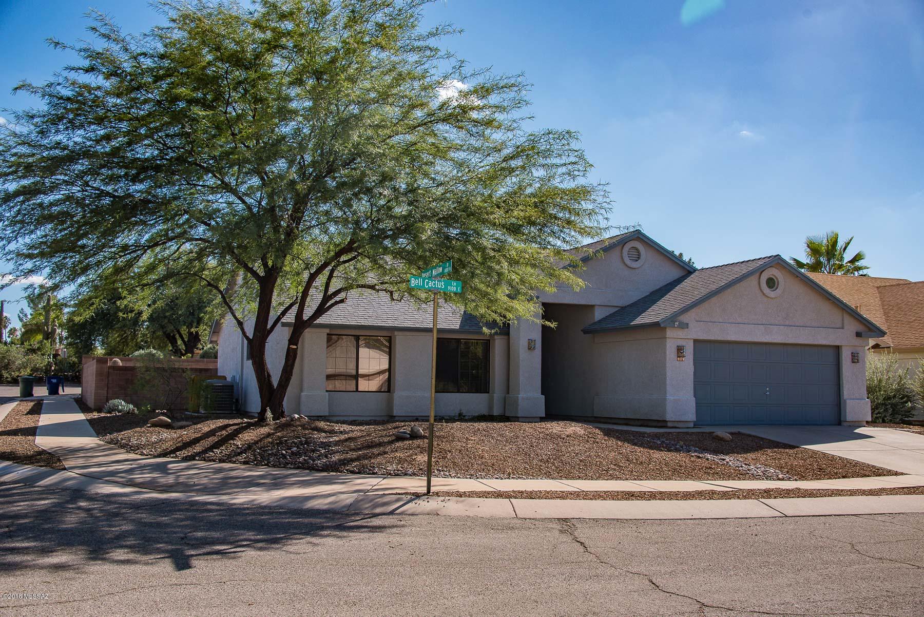 Immaculate home on a premium corner lot with beautiful mountain views! Tile throughout except brand new carpet in bedrooms. AC and Hot Water heater are only 2 years old. Fantastic condition, very open with high, vaulted ceilings, ceiling fans, wood blinds, custom security doors. Very clean and ready to move in today. Big backyard with covered patio, mature tree, saguaro, seating area, decorative rock, and a hot tub. Fantastic, convenient location yet hidden from view and traffic.