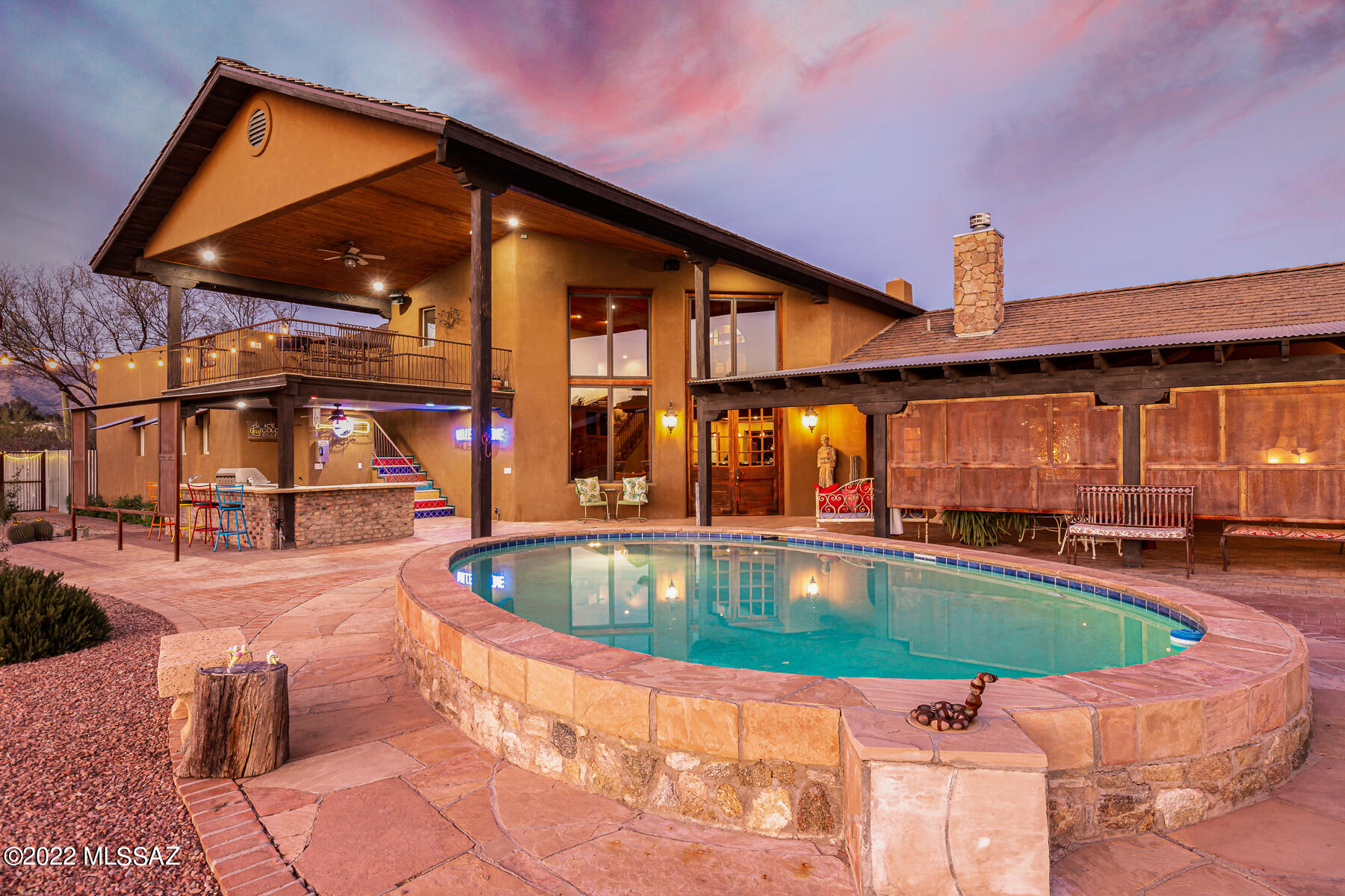 Live in the heart of the Tanque Verde Valley on 3.6 unrestricted (No HOA) acres of saguaro-studded natural desert w/ inspiring mtn views. 5930 sf Insulated Concrete Form (ICF) mn house w/ 991 sf attached GH, 1228 sf detached GH & massive ''drive through'' 5-car garage. Ideal for multi-generational families or utilize this versatile property to meet your needs w/out limitation-AIR BNB, Horses, RV's. Unique in the best way w/ a classic style that delivers delightful surprises at every turn. The rustic style is characterized by doors from Colonial Frontiers, brick & concrete floors, wood-planked ceilings, multiple FP's & metal accents. Dramatic entry w/ soaring ceilings & huge wall of windows that showcase the mtn views & floods the space w/ natural light. Visit www.themartinranchtucson.com Split bedroom floor plan offers a separate bedroom/bathroom & 2 spacious master suites. Each master suite w/ unique features & separate private patios. Master suite one has stone covered fireplace, bathroom w/ dual vanities, 2 separate showers, his & hers closets, clawfoot tub & large private patio w/ outdoor shower.   2nd master suite has large media room w/ mini kitchen, private patio w/ mountain views, bathroom w/ dual sinks, clawfoot tub, custom tile shower & walk-in closet. Upstairs loft area w/ wet bar is a flexible space that can be used for watching sports, playing games, exercise room, office, library, or study. Dynamic kitchen area w/ butlers pantry is open to a great large room designed w/ entertaining friends & family in mind. Charming, separate & distinct dining room w/ indoor grill/FP from original 1953 home w/ wood-beamed ceilings.  The great room flows to true resort-style back yard w/ shaded outdoor dining room, pool, putting green, outdoor kitchen area, upstairs deck to capture both city & mountain views, huge built-in fire-pit made of stone & an outdoor movie theatre. The two-bedroom detached guest house was built as a second residence w/ features that include a darling front porch, stone fireplace, fully-outfitted kitchen & laundry room. The guest house leads to the show-stopping 5-car garage.  Attached 991 SF guest house w/ 2 bedrooms has a separate entrance & can be separate from the house or- if you need more bedrooms, it can be accessed from the main house. Additional large fenced-in yard on the east side of the home provides yet another flexible space. Built-in 1953 by the original owner in the area, the home was purchased by the current owners in 2004 & completely transformed by 2007 w/ the current new & expanded home & guest houses w/ all new major systems on the house.  This property is zoned for horses & has plenty of room to add horse facilities. There is tons of flexible space work with making this a one-of-a-kind property. The close-in Tanque Verde Valley location places you minutes from grocery stores, restaurants, services and is much closer to the center of Tucson and the Foothills.

In the area: Live in seclusion with proximity to restaurants, shops, schools, many outdoor activities, and golf clubs. 
Less than 5 minutes away from the 49ers Country Club.
Spread over 110 acres, the course is known for its lush, mature landscaping and excellent course 
conditioning. A full-service restaurant open to the public, The Rincon Mountain Grill, has been expanded and upgraded. Forty-Niners CC has a swim team for the kids, summer camps, and several events throughout the year. The new workout facility for fitness training is fully equipped, with 24-hour access and tons of fitness classes.
Less than 5 minutes away from La Mariposa Athletic Club with w/tennis courts, workout classes, lap pool, etc. Just 10 minutes away is the Arizona National Golf Club, a beautiful desert golf course in the foothills of the Catalina Mountains.
Convenient location to get to Mt. Lemmon. With a summit elevation of approximately 9000 ft., It is the highest point in the Catalina Mountains. It is located in the Coronado National Forest north of Tucson and is an incredible retreat from the hot temperatures in Tucson in the summer. Enjoy skiing, hiking, biking, and rock climbing.
Saguaro National Monument East-Located on the east-side, Tucson's cactus forest tucked within. Saguaro National Park East and nestled up against the Rincon Mountains, is as starkly beautiful as any primeval forest you've ever seen or imagined.

Living in this rural area of Tucson provides several horse boarding facilities and horseback riding 
opportunities. Bobby Houston's Horse Riding is close by, and hosts ride in the Saguaro National Park.