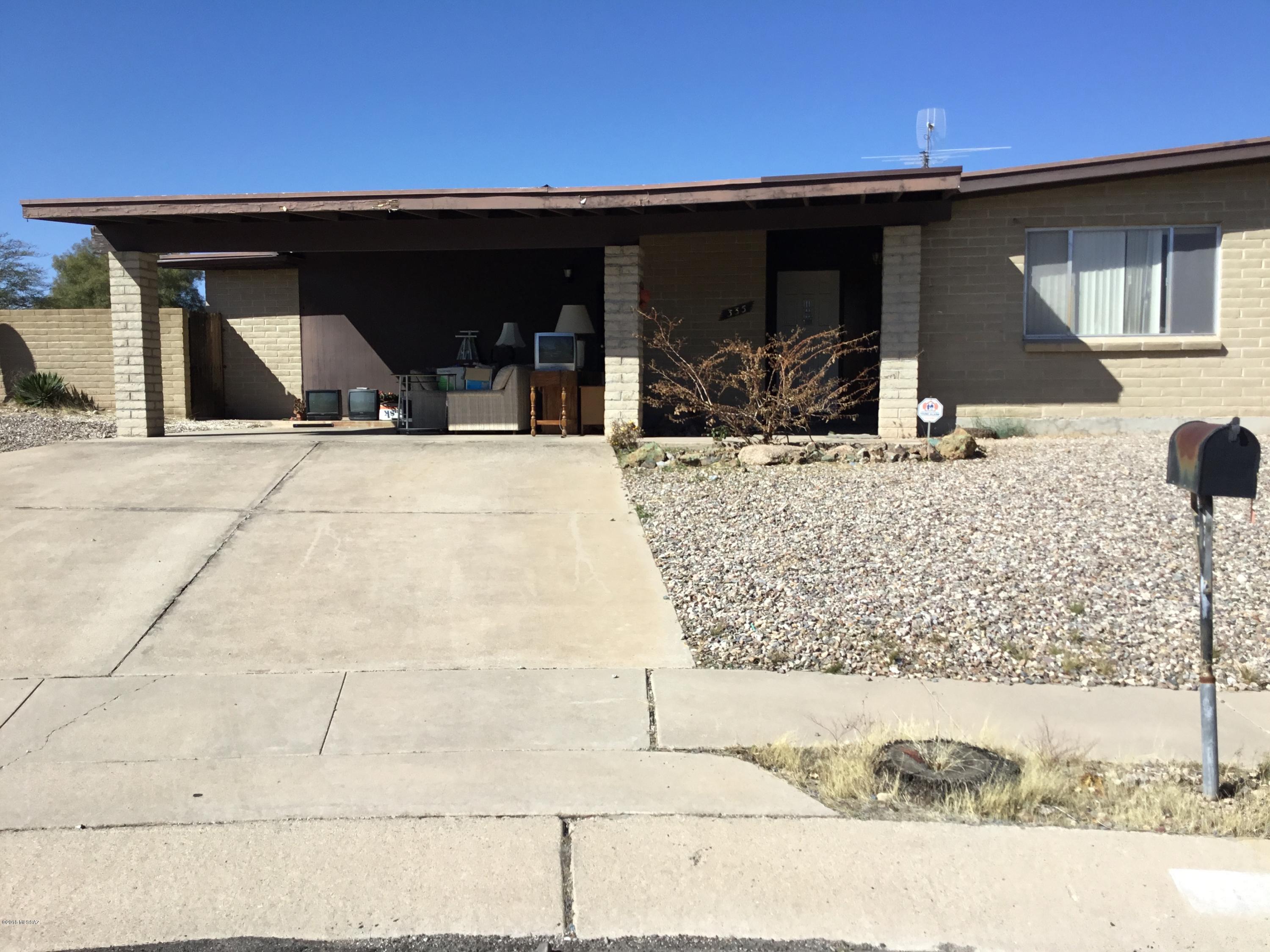Excellent fix up opportunity. Solid brick home with pool in desirable neighborhood on a cul de sac. Walk to Saguaro High School. Great bones!!!