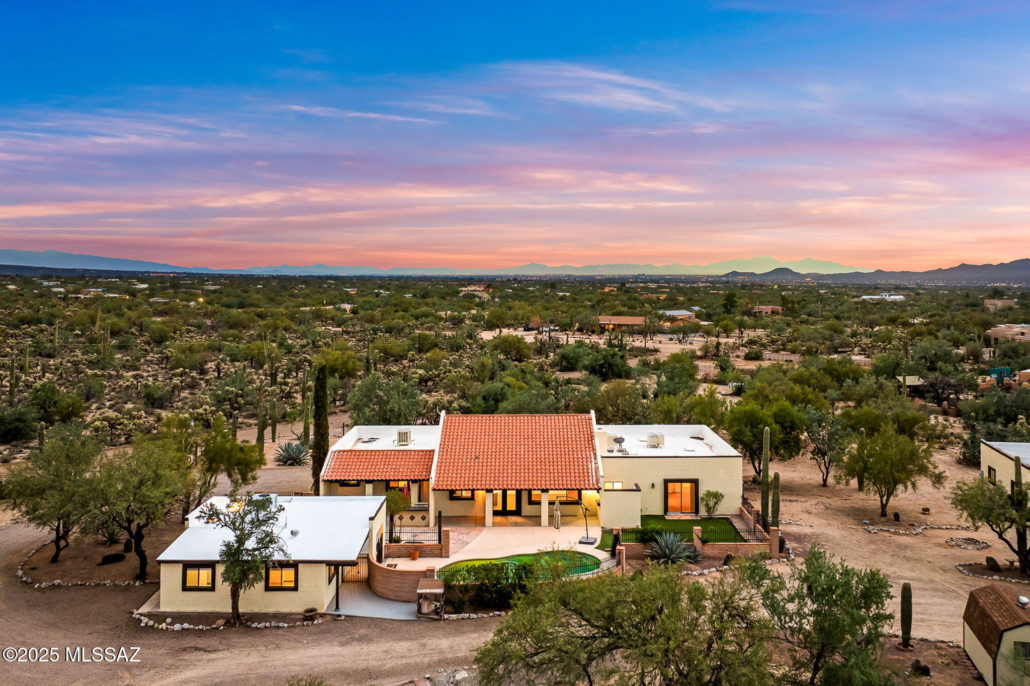 3.33 ACRE HORSE PROPERTY with GUEST HOUSE, POOL & NO HOA! This updated Northwest Tucson retreat offers 3 beds, 2 baths in the main home plus a 1-bed, 1-bath guest house—perfect for guests, family, or income. Fresh paint inside/out, reimagined living spaces, and sparkling pool. Horse-ready setup with round pen, 5 stalls, and fenced acreage. Attached 2-car garage plus detached 2-car garage/shop for gear, projects, or toys. Enjoy wide mountain views, privacy, and freedom on 3.33 acres—minutes to shopping, dining, and top schools!