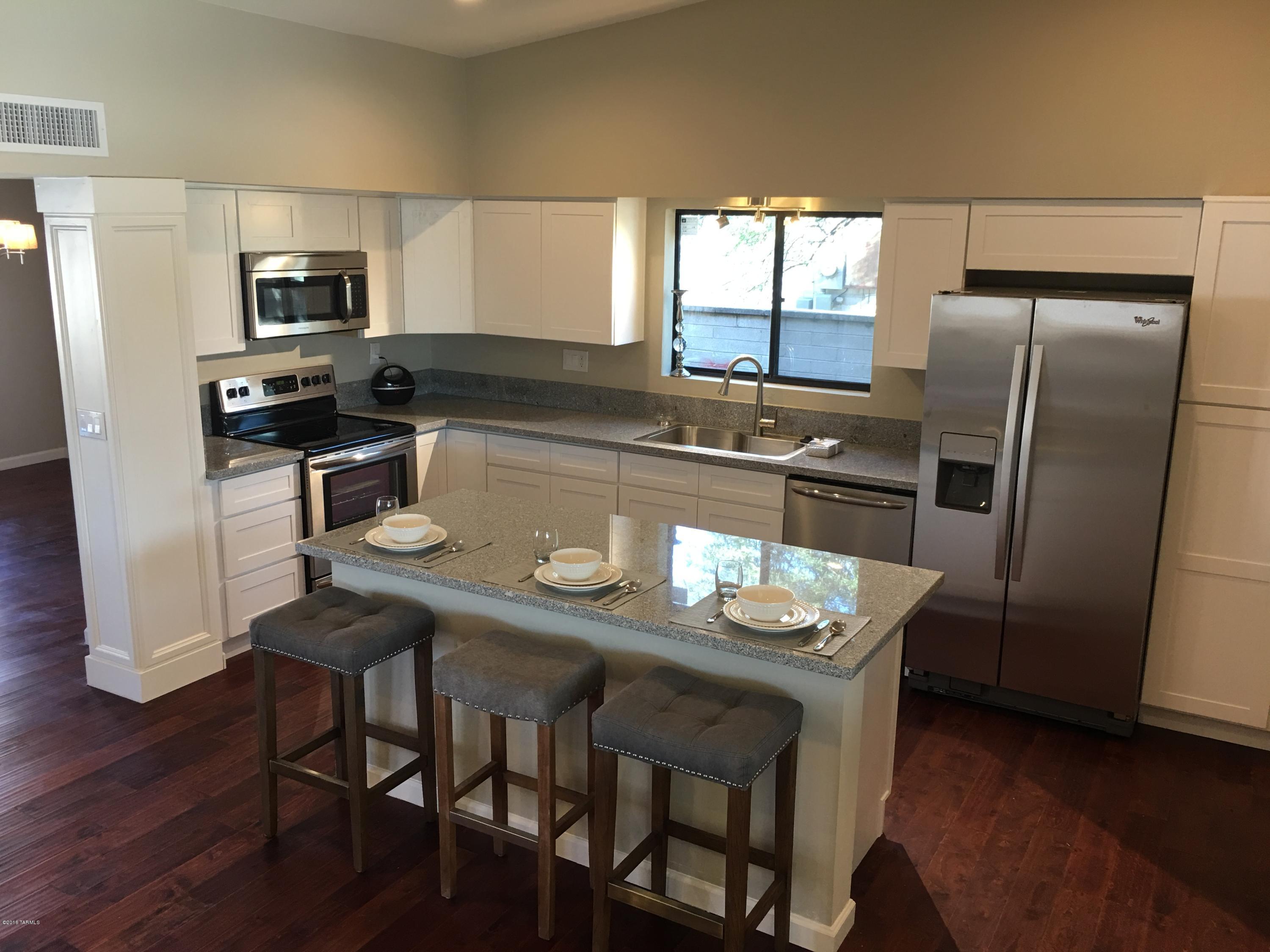 Seller will accept or counter offers between $219,000 and $229,000 for this amazing 4 bedroom family home remodeled to perfection. Every inch of this home has been touched by our team. New kitchen, new granite counters, new upgraded stainless appliances, sitting bar, new cabinets throughout, new wood flooring, new carpet, new bathrooms. Jeff Lewis paint and inspired design. One of the nicest homes in the area, this one won't last. Owner/Agent