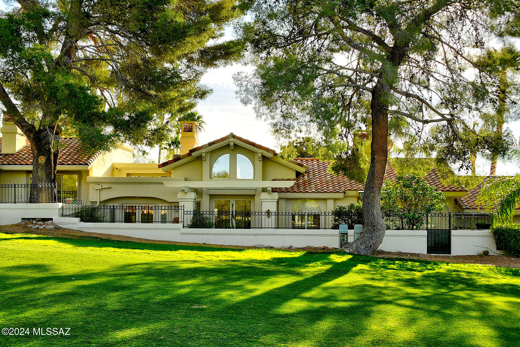 Classic Santa Barbara Style Patio Home located on a Gorgeous Golf Course Lot in Skyline Country Club.  A Spectacular Setting, Tucked away in a Tree-lined Enclave of Gracious Homes and Sweeping Mountain Views.  Gated Courtyard Entry and Grand Foyer are just the lead-in to the Light-filled Interior under a 20' Gabled Ceiling, Wood Beams, French Doors and Multiple Fireplaces.  Expansive Doors and Windows with Access to Multiple Patios and Views.  Low-care Landscaping designed for the modern lifestyle and great entertaining.  Skyline Country Club is a Guard Gated Community carved into the Catalina Foothills, where you can enjoy some of the most spectacular scenery of any golf course community in the SW.  Limited Club Amenities included in your HOA dues.  You'll love living here!