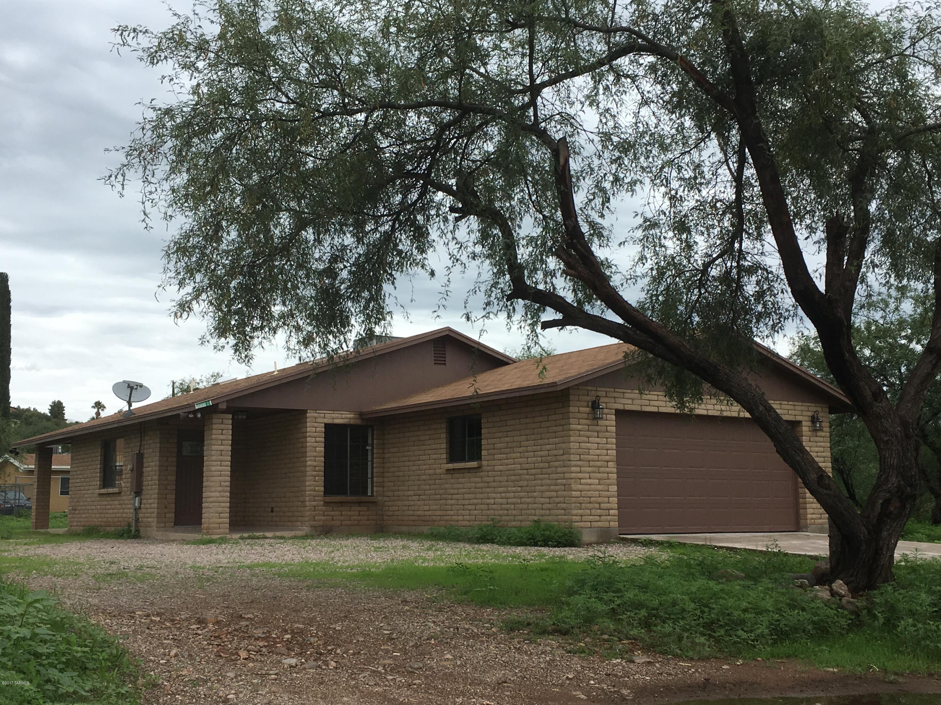 Exceptional home located on a spacious lot in desirable Rio Rico neighborhood! Renovated property features block construction, concrete driveway, stainless steel appliance, canned lighting, covered front/back patios, vaulted ceilings, dual sinks in master bathroom, and a huge backyard! Conveniently located within a mile radius of Rio Rico Fitness Center, the Rio Rico Golf Course, and neighborhood walking/running path!