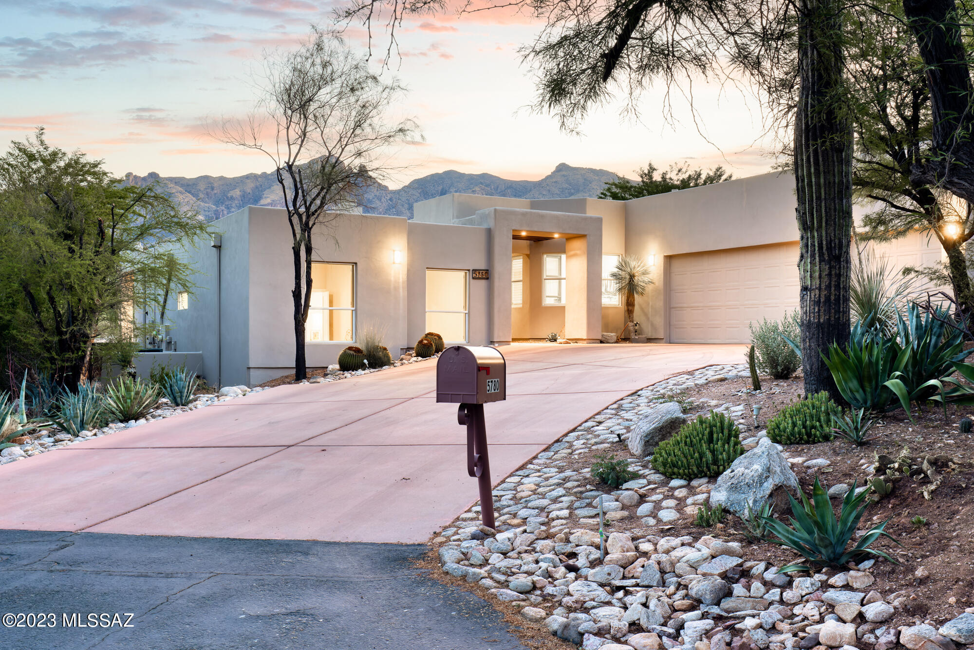A limited opportunity to own this contemporary tour de force in the exclusive gated community of La Paloma Estates. Living the La Paloma Lifestyle makes this premier neighborhood, located in the center of the Catalina Foothills, the pinnacle of Foothills living. Beset with quality design, thoughtful details, and premium finishes, this 4 BR, 3 BA + office/den, has a panoramic view of the Santa Catalina mountains. Completely remodeled in 2019, the kitchen is augmented by the elegance and quality of Poliform custom cabinets, imported from Italy. Fischer & Paykel and Miele appliances adorn the kitchen, which serves as the centerpiece of the home.

The split floor plan is highlighted with functional spaces and an abundance of natural light. Contemporary minimalism with custom solid oak closets, updated lighting and fixtures and a style highlighted by simplicity, clean lines, and a monochromatic palette. The primary bedroom, with direct access to the backyard and its own private covered patio is further enhanced with a spa-like primary bathroom with a dual head walk-in shower and soaking tub.

Two nicely sized additional bedrooms sit on the west side of the home, while a guest suite adjacent to the kitchen features an ensuite bathroom and private patio.

The great room is versatile for both entertainment or more intimate family gatherings, with unrestricted and dramatic views of the mountains. The family room has flexible options as a true family room, playroom, dining room or even bar and entertainment area. The custom glass window wall encloses the office, allowing privacy yet maintaining the views and open feeling.

The low care private backyard is an ideal space for both large scale entertaining and family fun. The panoramic Mountain backdrop and the silhouette of the highly regarded La Paloma Resort & Spa reinforce that you are living the resort lifestyle. With over 365 Sq Ft of covered patios, outdoor shower, glass rock firepit, and built-in BBQ, it is outdoor living at its finest.

Concrete floors throughout, updated bathrooms and renowned Tucson architect Kevin B Howard has designed a 524 Sq Ft guest house that sits on the west side of the property - these complete plans are included and will be provided to the Buyer.

Functional details and upgrades allow for low maintenance as either a lock & leave second home or primary residence.

* A three-car garage with additional guest parking on the private cul-de-sac
* Owned solar
* Manned Gated entry to La Paloma Estates

La Paloma Country Club:

Scenic Beauty: La Paloma Country Club is located in the stunning Catalina Foothills of Tucson, Arizona. The surrounding area offers breathtaking views of the Santa Catalina Mountains and the desert landscape, creating a picturesque setting.

Golfing Paradise: The country club is renowned for its championship golf courses. Golf enthusiasts can enjoy playing on three 9-hole courses designed by Jack Nicklaus, each offering a unique and challenging experience. The well-maintained fairways, strategic layouts, and stunning views make it a golfer's paradise.

Luxurious Amenities: La Paloma Country Club offers a range of upscale amenities. These include a clubhouse with fine dining options, a fitness center, tennis courts, swimming pools, and spa facilities. Members can indulge in various activities and enjoy a luxurious lifestyle.

Exclusive Membership: The club has a private membership, which ensures an exclusive and upscale atmosphere. The community is known for its high standards of service and attention to detail, providing an exceptional experience for its members.

Catalina Foothills:

Natural Beauty: The Catalina Foothills is a picturesque region nestled in the foothills of the Santa Catalina Mountains. The area is known for its stunning desert landscapes, including saguaro cacti, lush vegetation, and scenic hiking trails. The natural beauty attracts outdoor enthusiasts and nature lovers.

Desirable Location: Catalina Foothills offers a desirable location with a peaceful and upscale ambiance. It provides a tranquil retreat away from the hustle and bustle of the city while still being in close proximity to urban amenities. The area is known for its high-end residential communities, excellent schools, and shopping options.

Outdoor Recreation: The Catalina Foothills offer numerous opportunities for outdoor recreation. Hiking, mountain biking, rock climbing, and horseback riding are popular activities in the nearby mountains and canyons. Sabino Canyon, located in the Foothills, is a popular destination for hiking and picnicking.

Cultural Attractions: The Catalina Foothills is home to various cultural attractions. The Tucson Museum of Art, Arizona-Sonora Desert Museum, and DeGrazia Gallery in the Sun are all nearby, providing opportunities for art appreciation and learning about the region's history and natural environment.

Overall, La Paloma Country Club and Catalina Foothills offer a combination of natural beauty, luxurious amenities, recreational opportunities, and an upscale lifestyle, making them highly desirable and appreciated by residents and visitors alike.