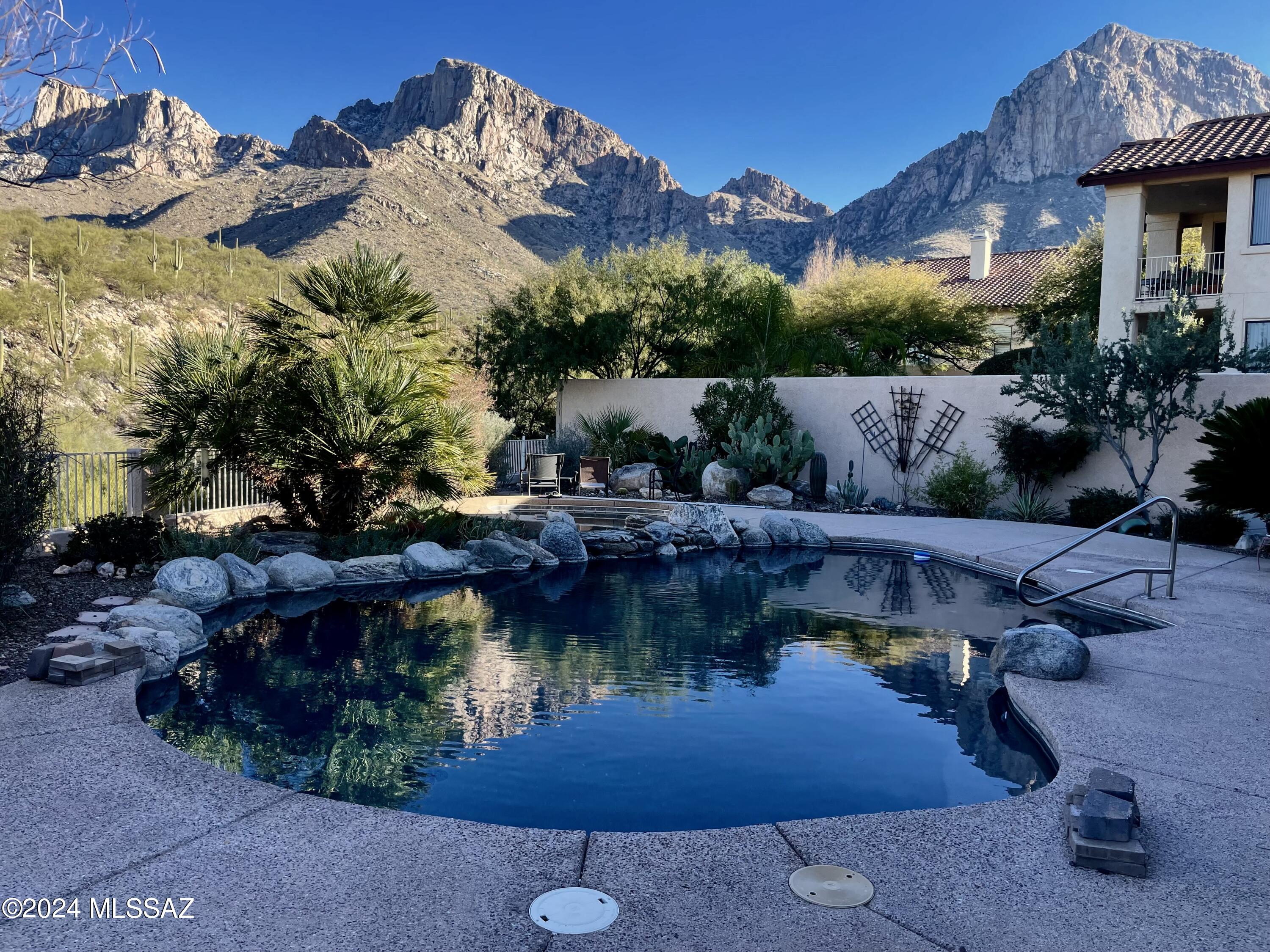 Check out this gorgeous, updated, well-maintained home on a high view lot in the Bighorn Point subdivision in guard-gated La Reserve. Enjoy lush and beautiful landscaping front and back, PebbleTech pool with spa and both up-close Pusch Ridge and distant city lights views. Great Room, split-bedroom floorplan with high ceilings and upgrades galore. Extras include a sleek vented linear gas fireplace, wood shutters, pre-settable thermostatic dial shower temperature control in owner's bath, 16-SEER Main HVAC unit, power screen for sun/bug control on the patio, power cover for the pool that can be removed and stored, and an extra space in the garage for storage or workshop.