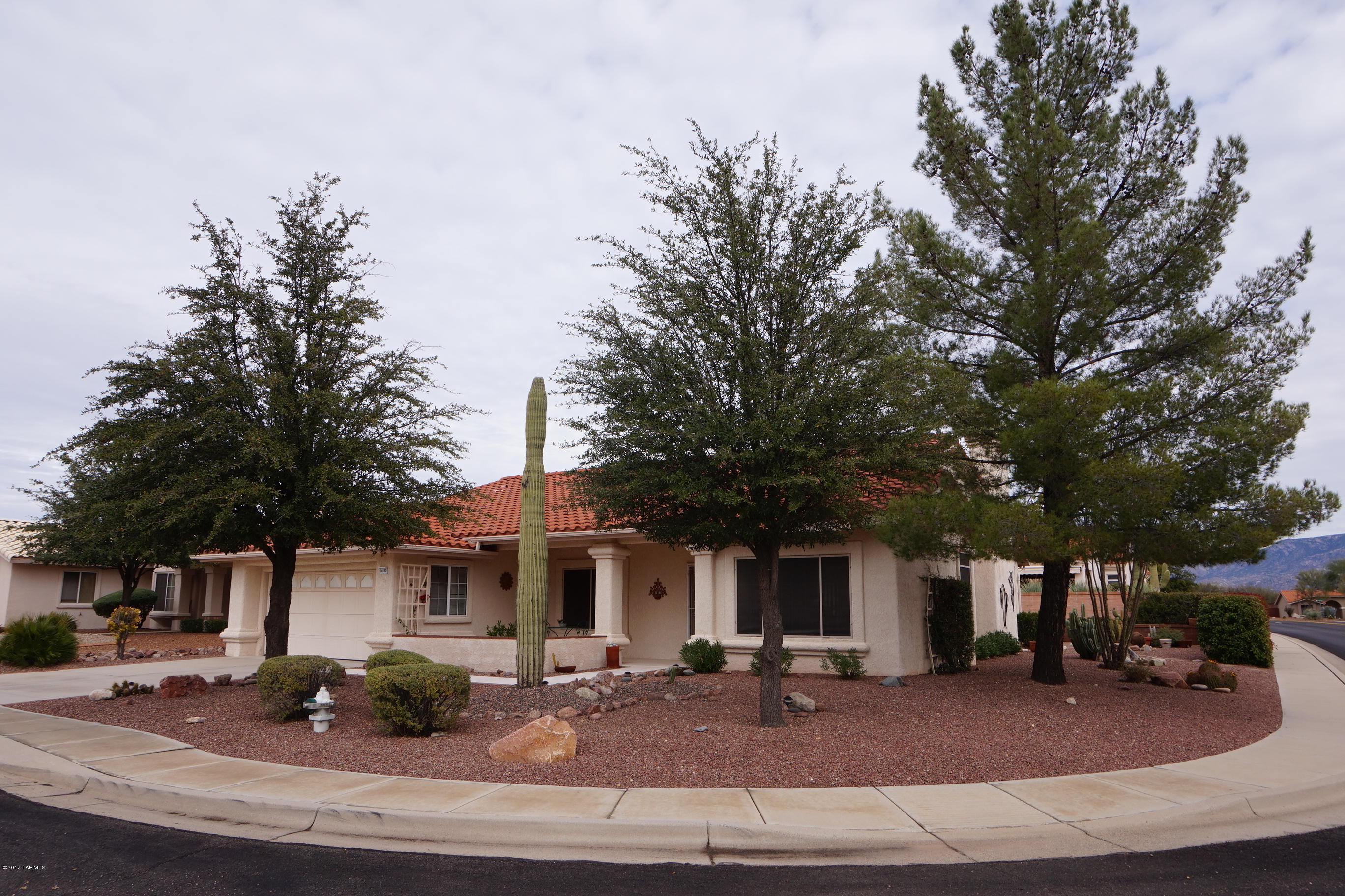 BACK ON MARKET 4/24/17! PRICED TO SELL!!  LIGHT, BRIGHT AND VERY INVITING 2 BR/ 2 BA PLUS OFFICE, 1779 SQ FT MADERA PLAN ON CORNER LOT! HOME HAS A VERY OPEN FLOOR PLAN WITH FAMILY ROOM OFF KITCHEN PLUS SEPARATE LIVING AND DINING AREAS. AMENITIES INCLUDE COZY GAS FIREPLACE, BREAKFAST BAR PLUS EAT-IN NOOK, CERAMIC TILE IN TRAFFIC AREAS, HIGH CEILINGS, MANY NICHES AND POT SHELVES, SPACIOUS MASTER SUITE WITH DOUBLE DOORS, BAY WINDOW, DOUBLE VANITIES AND ENORMOUS WALK-IN CLOSET, MANY CEILING FANS THROUGHOUT PLUS LOVELY BRICK FRONT AND BACK PATIOS. NICELY LANDSCAPED YARDS WITH PLANTERS AND PRIVACY (NO NEIGHBOR ON ONE SIDE) AND LOVELY CATALINA VIEWS! FURNITURE AND CONTENTS AVAILABLE ON A SEPARATE BILL OF SALE IF BUYER IS INTERESTED.