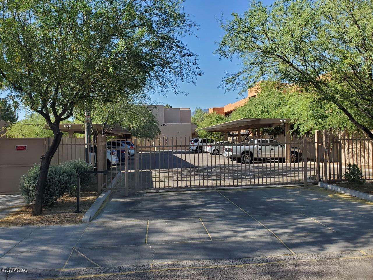Gated Community! Very convenient north central location. Only 3 miles from the U of A. Newer 3BR/2BA condominium units with 9' ceilings. No one above or below. Newer wood-like ceramic tile on main level! Newer HVAC unit. Spacious main level has living room, kitchen, dining area, bedroom, bathroom and laundry. Upstairs has the 2 additional bedrooms and bathroom. Private rear yard has 6' privacy fence, covered patio and storage room. Each unit has 2 covered parking spots. Very well maintained!  Close to U of A, McCormick Park, shopping, bus lines, The Loop, etc. Tenants pay gas, electric and water. One of the owners is licensed to sell real estate in the State Of Arizona.