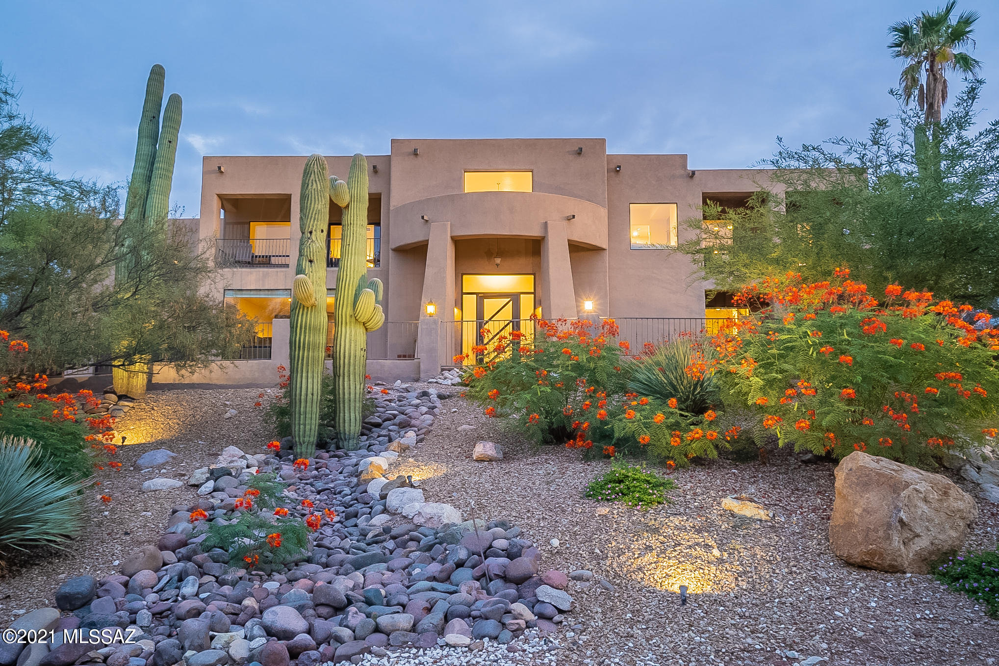 Check out this 2007 custom built home with pool tucked away in Hidden Valley! This contemporary home was designed with gorgeous panoramic mountain views, a grand entrance and walking into a breath-taking foyer. This home has 5 bedrooms and 4.5 baths with an office, game room and media room. The first floor features the living area with two-sided fireplace that opens to dining area and kitchen, two bedrooms and a master suite. The upstairs has an amazing master suite with a separate sitting area with fireplace, a huge walk-in closet and a spa like bathroom with gorgeous mountain views from the balcony and jetted tub. The final bedroom is on the other end with its own balcony along with the game room and media room. Located with close proximity to Sabino Canyon and championship golf courses.