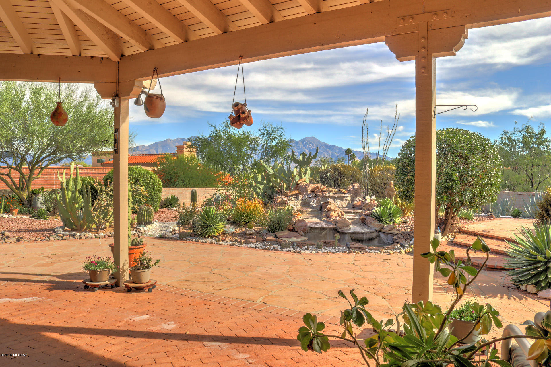 TAKING BACK UP OFFERS!
Your Desert OASIS awaits! Southwestern charm, very spacious; Privacy & Magnificent views on elevated double lot.  High ceilings, celestial windows, exposed beams and tons of light welcome you. Open concept dining & great room with wet bar.  Entertainers delight, wrap around covered patios, water feature, elevated sundeck, gas bib for BBQ, even an out back powder room for guests. Enormous MB, ''Must See Views'' from sitting area. Walk-in closet; walk out doors to patio. Den includes murphy bed & cabinetry. Expanded Granada floor plan with extra garage storage. Sturdy slump block construction, desert shade trees, front and back landscaped. Space, Views, Privacy its all HERE!  
New HVAC 2017, New H2o Heater 2019.  (Appliance replacement allowance with full price offer