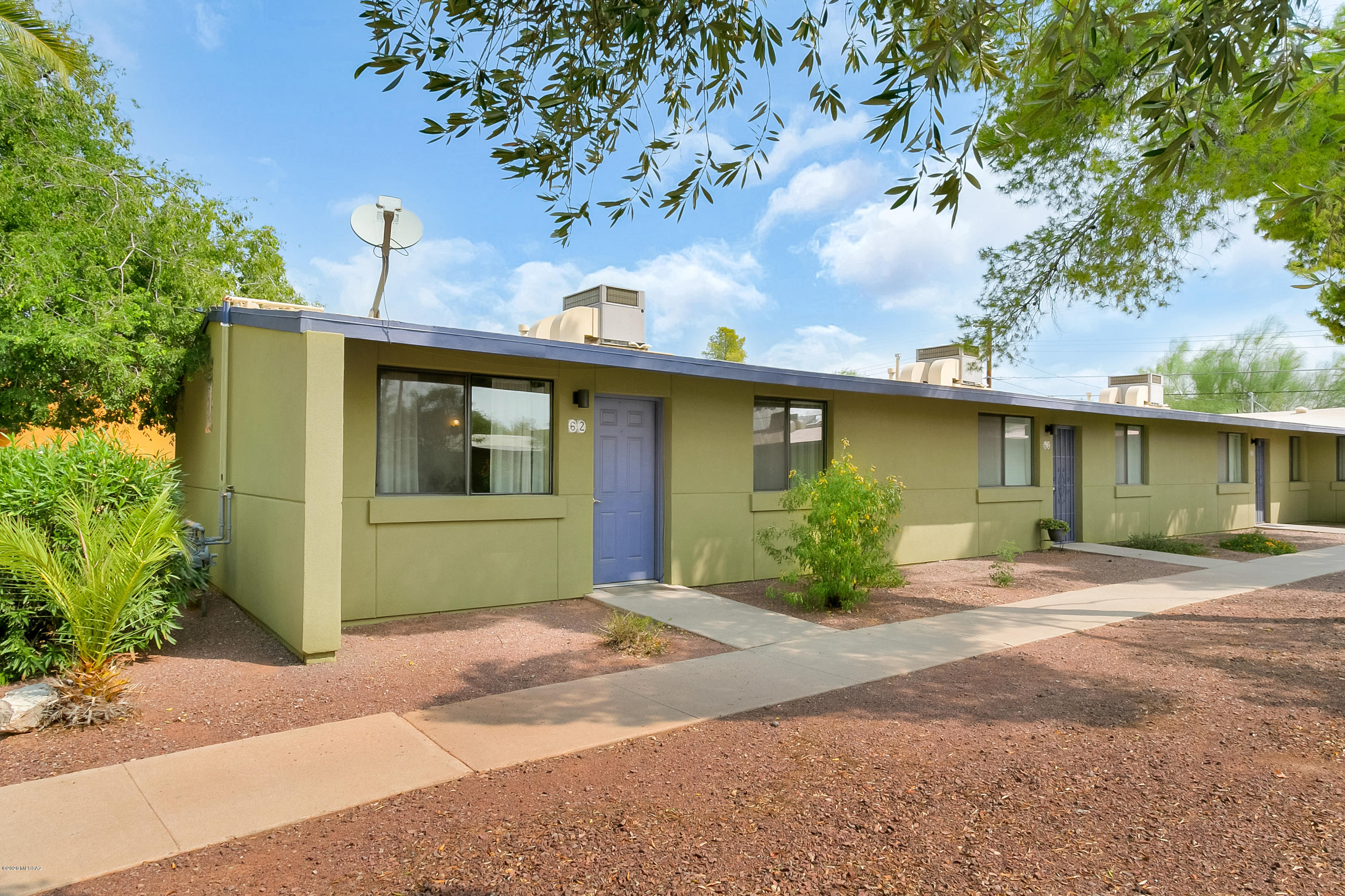 Charming single story condo in a beautifully maintained Gated Community conveniently located near St. Mary's Hospital, Pima College, Tumamoc Hill, I-10, and Downtown. This 2 BR/1 Bath  unit feels larger than its size and is light and bright. Ceramic Tile Floors throughout.  Barrio colors and lovely vegetation enhance the enjoyment factor, along with the community pool/spa, rec center, & playgrounds. This is the perfect unit for owner occupants or as a rental. HOA fee includes: all exterior maintenance, roof, fire, trash, common area (roads, gate, rec center, pool, spa etc).