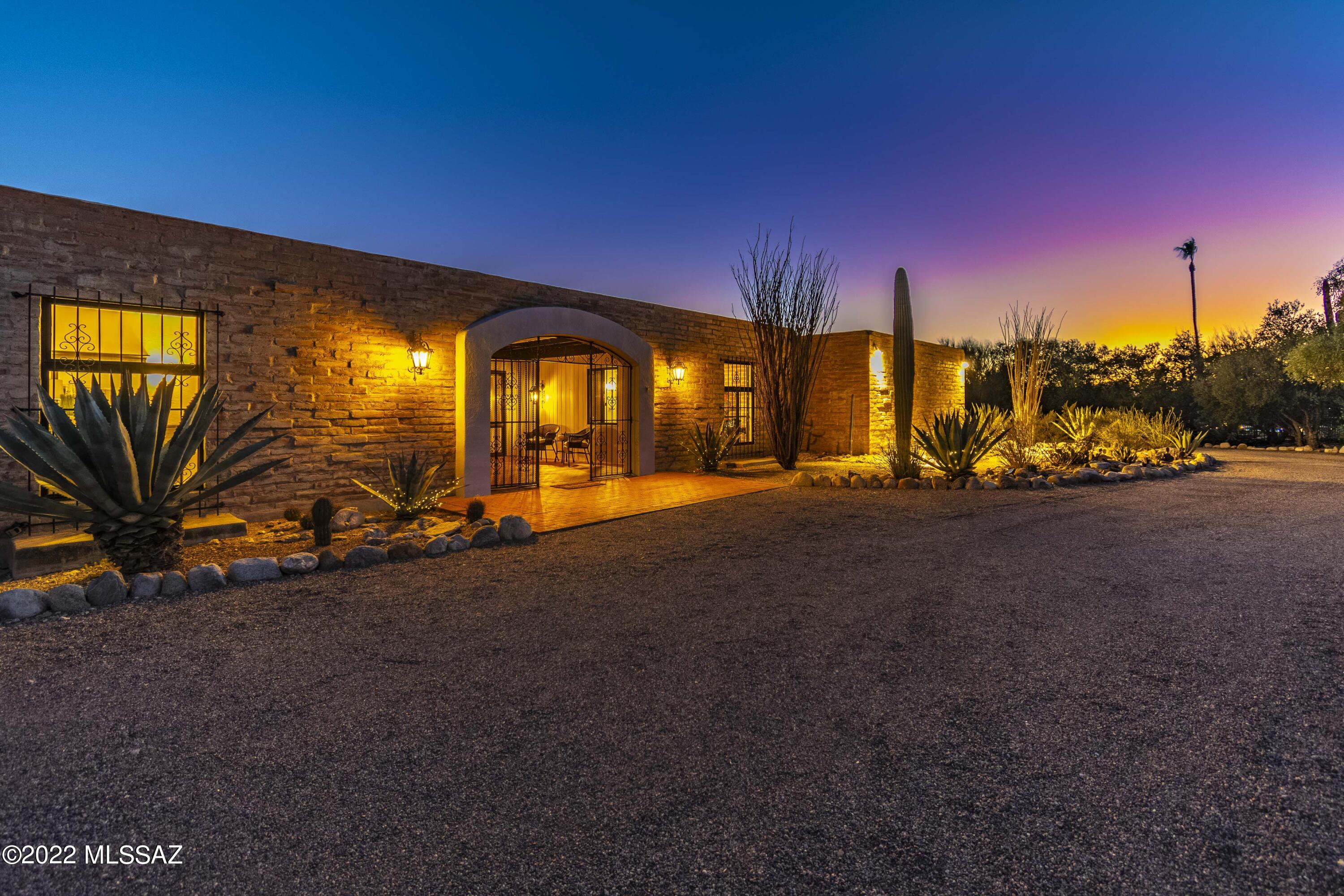A rewarding escape peacefully situated: Luxurious and updated, this La Quinta built masonry home of 1922 sq ft rests on a 1.047-acre lot on a tranquil cul-de-sac in the highly coveted Catalina Foothills Estates No7 neighborhood. Beyond the enclosed entry courtyard with amazing mountain views and foyer space, the home flows into a gorgeous, open-concept great room, dining, and kitchen area. This home is truly made for both entertaining and everyday living, with plenty of space and fabulous views from the floor to ceiling, dual paned windows with northern and southern exposures. The expansive kitchen is equipped with white quartz countertops and custom cabinetry. ***see continued Two of the bedrooms sit just off the great room, each with gorgeous window views, ample closet space and just steps to their updated bathrooms. The third bedroom is currently being used as an office with a lovely built-in desk and bookcases. Walk outside to your backyard oasis, multi-level patio, solar heated pool with city lights and desert sunset views. This property is immaculate, well-cared for, and ready for new owners. Welcome home!