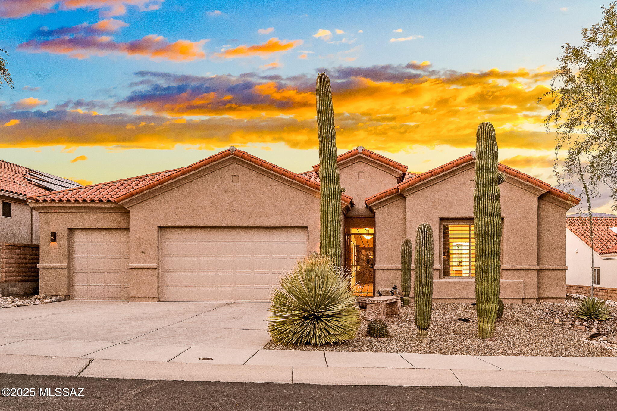 Immaculate home in charming gated community! Beautifully maintained home has 3 bdrms and den—with closet—could be 4th bdrm. Enjoy open floorplan with high ceilings and mountain views. The chef's kitchen and breakfast bar offers plenty of prep space. Step into the enclosed Arizona room opening to a gorgeous, easy-care yard—perfect for year-round enjoyment. The large 3-car garage includes a separate third bay with ductless A/C, ideal for a workshop or gym setup. The primary suite includes a huge walk-in closet and an updated bathroom featuring floor-to-ceiling tile and a walk-in tub. Throughout the home, you'll find stunning concrete overlay flooring. Enjoy community pool/spa, and a recreation center and nearby shopping, banking, and top dining spots—you won't want to miss this oppor