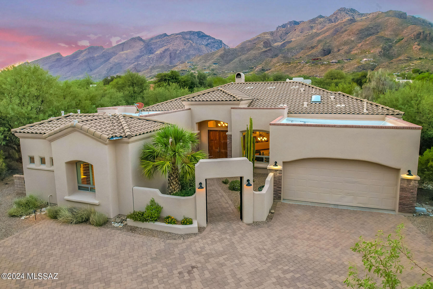 Spectacular home in gated Ventana Reserve. Unobstructed mountain views. Professionally landscaped backyard with fireplace and built in BBQ. Paver driveway leads to a private courtyard entry. The home is all on 1 level with no steps and an open floorplan. Chefs kitchen with stunning granite and custom cabinets, a butlers pantry and a planning desk. Wet bar with wine chiller. All bedrooms are en-suite including a separate casita. Primary bedroom features 2 enormous closets, a sitting area, jetted tub and snail shower. Greatroom is truly great with high ceilings, crown molding, fireplace and big views. Den features a grand built in desk and cabinets. Plantation shutters throughout. Small friendly gated enclave near Ventana Canyon. Perfect for entertaining, a family or lock and go.