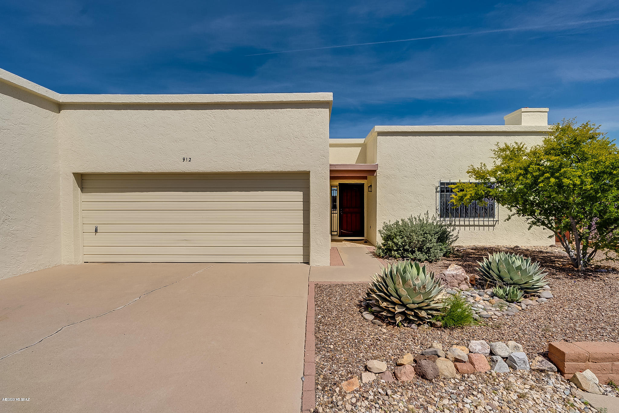 FULLY FURNISHED end unit townhouse close to the pool with mountain views and open back area creating privacy. Lots of storage plus a 2-car garage. The kitchen has been updated with newer soft close cabinets, porcelain counter tops, and added pantry. Office space and french doors added to the master bedroom.  Roof to be coated with warranty and termite warranty.