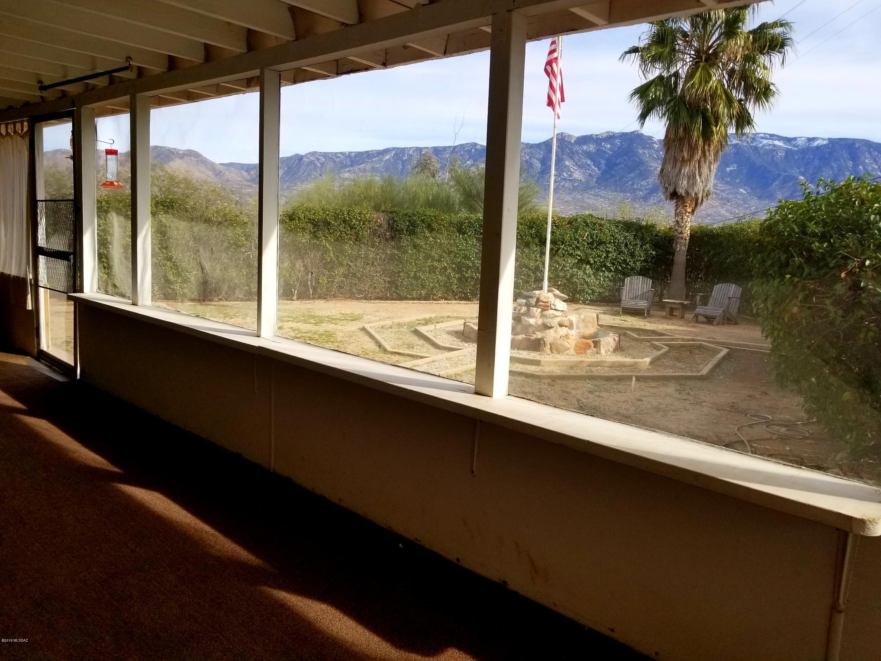 IT'S ALL ABOUT THE VIEWS & POSSIBILITIES with this meticulously maintained 3 bedroom, 2 bath home. This 1700 SqFt property  sits on a 1.17 acres with absolutely mesmerizing Catalina  mountain views! This home has everything you need including a beautiful screened in front porch to relax and enjoy Arizona living at its finest! Electrical was updated for you in 2016,  A/C and heat pump installed in 2016. This is a must see property with charming character throughout! Enjoy the covered 3 car port spaces, split bedroom plan, 4 newer appliances. SO many options to explore this could be your snow bird home,  vacation rental or bring your horses and toys and make this your private oasis. This home is located close to all amenities and awaits your touches. Home warranty is being offered