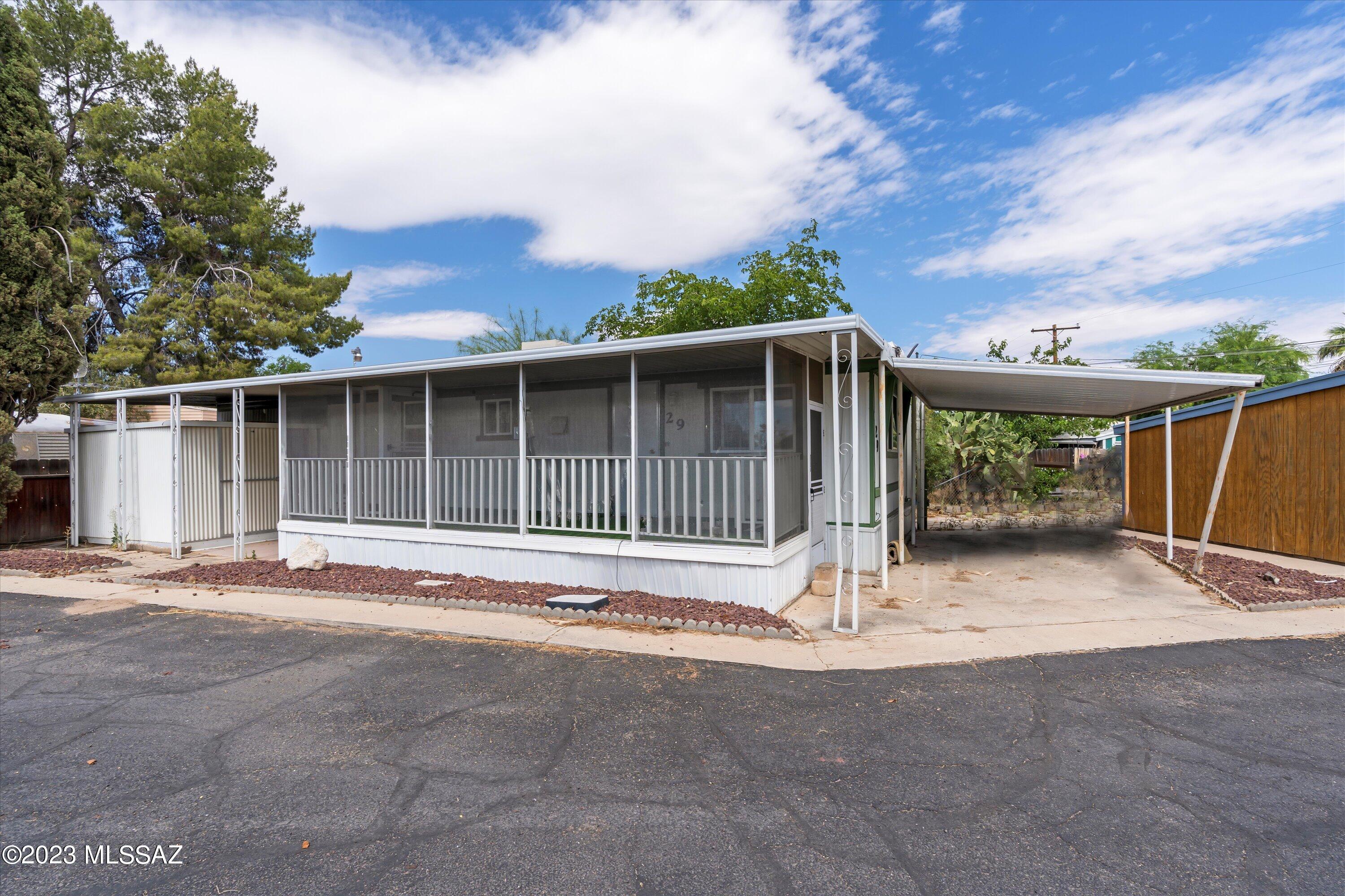 Welcome to Noblesse Oblige 55+ MHP. Located Near the Highway its easy to get anywhere within Tucson. The Park association is $550 a month and has a Pool, Rec Room, Shuffle Board, Laundry Facility, and Maintenance of the Facilities. The mobile home has been renovated and has vinyl flooring throughout the main area, with carpet in both bedrooms. The screened in porch pretty much doubles as a second living area.