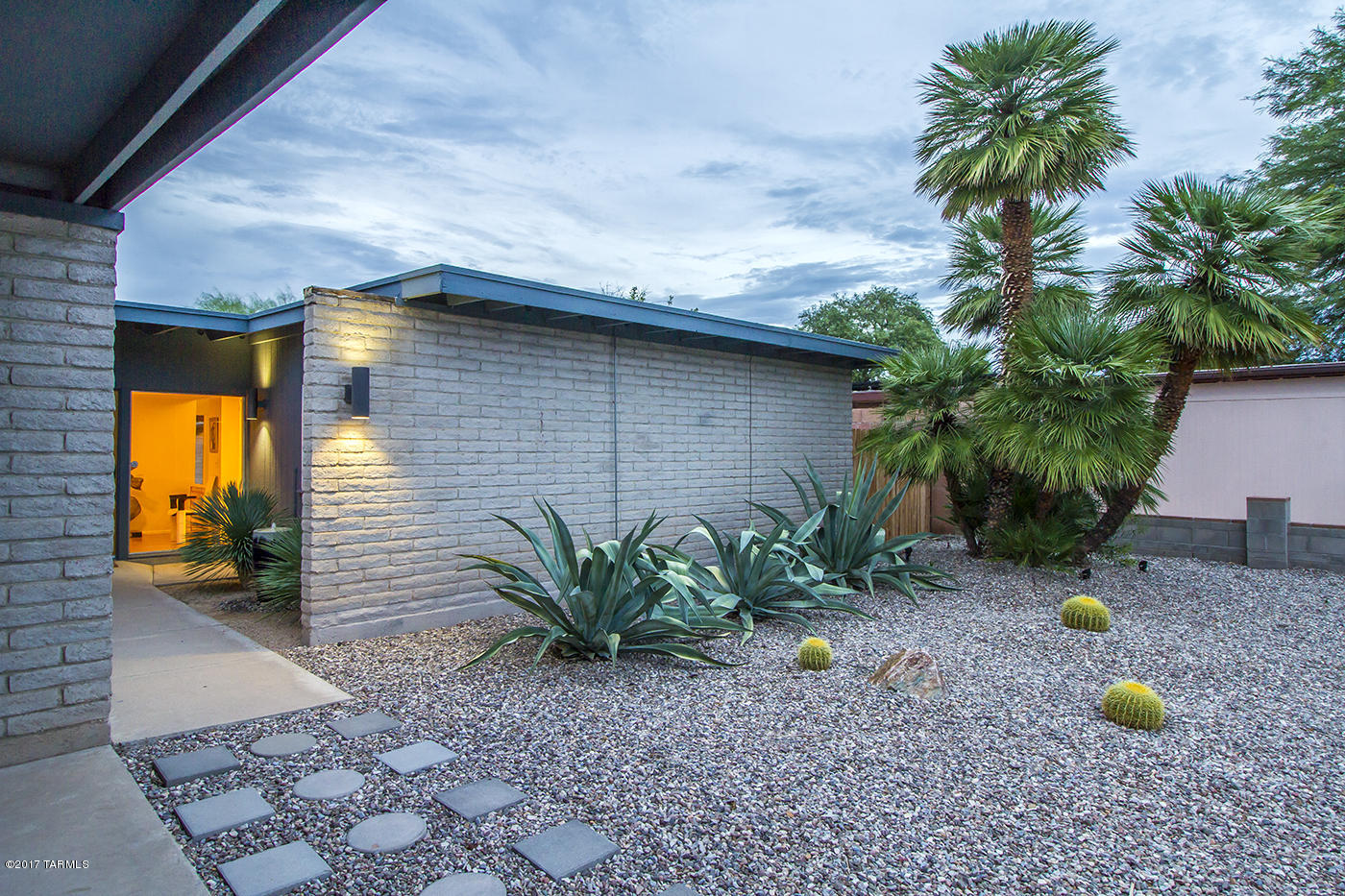 Offering an iconic 70's atomic ranch with a fantastic split floor plan with the kitchen dividing two living spaces, family room and dining + living room, one whole wing of bedrooms, and a giant master suite.  Beautiful walls of windows to the front courtyard entry and the pool with full-length covered patio.  Developed by J Herbert Oxman who did beautiful mid century modern homes including the Windsor Park subdivisions. This is quality construction featuring grey slump block.  Be sure to visit the Virtual Tour link for this property to ''walk-thru'' in 3-D!  Floor plan is also attached in Documents tab.
