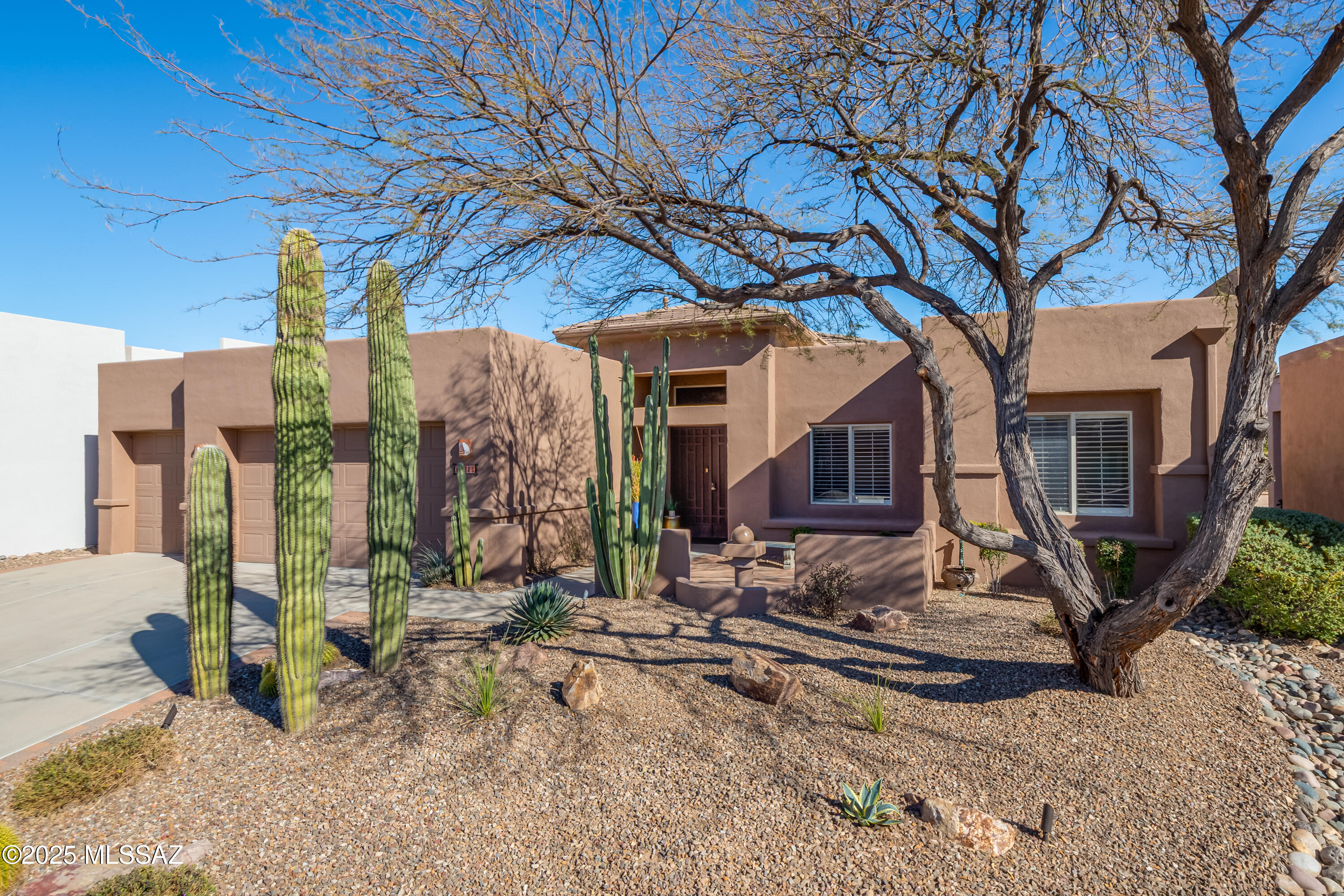 Enjoy the best of Arizona living in this gorgeous 2,549 sq. ft. masonry home with a 3-car garage and sparkling pool, located in the upscale, 68-home gated community of Fairfield Rancho Vistoso in Oro Valley—the ''Scottsdale'' of Tucson.
A welcoming front courtyard leads into a bright, open interior with high ceilings, abundant windows, 2 bedrooms, a den, and 3 baths. Recent upgrades elevate the home throughout, including new flooring in the main living areas and custom California Closets. The primary bathroom has been tastefully remodeled with a relaxing soaker tub and a beautifully tiled walk-in shower. The kitchen has also been refreshed with newly painted cabinetry and stunning quartz countertops, giving the space an updated, modern feel. The very private, east-facing backyard offers a serene retreat with a refreshing pool, covered patio, multiple seating areas, and lovely mountain views.
Additional highlights include a prep island and generous entertainment bar in the kitchen, a spacious great room with a raised-hearth fireplace and built-in media/display shelving, a guest powder room, a gracious primary suite with direct access to the patio and pool, and a king-size guest suite. Upgraded lighting, ceiling fans, and plantation shutters add comfort and style throughout.
Ideally situated near two premier public and private golf coursesVistoso and Stone Canyon Clubthis home is perfect as a seasonal escape or an exceptional year-round haven.