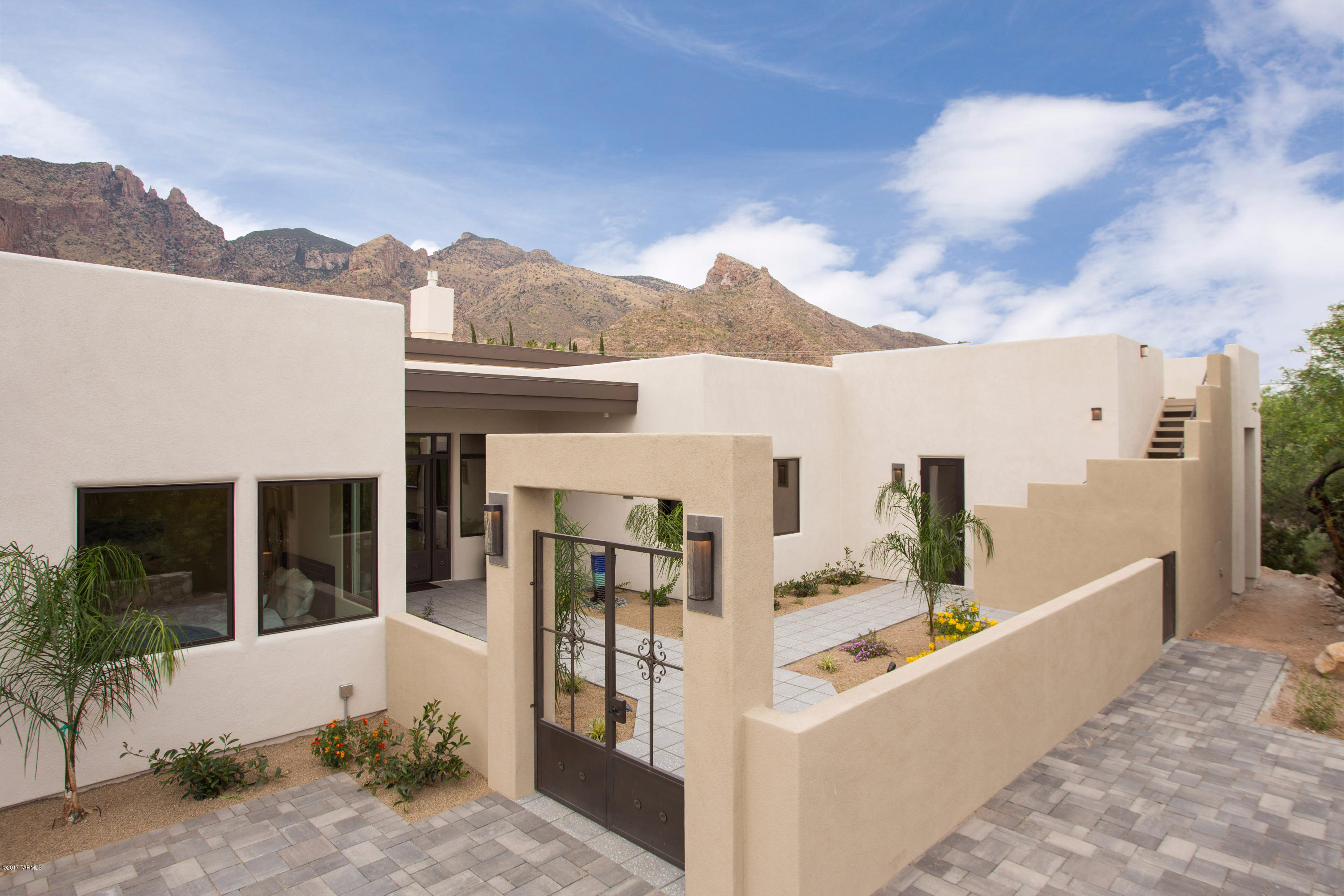 Stunning soft contemporary New Build with gorgeous Finger Rock ''Forever View''. State of the art one level floor plan with soaring ceilings. Fabulous kitchen, separate dining area and great room, all with patio and mountain views. Elegant  Master Suite with Catalina mountain view, upgraded finishes and large special walk-in closet. Split bedroom plan, each guestroom has private bath. Separate Guest House/Studio with Star Deck above for city lights & panoramic views. Gated central foothills location, quick access to La Encantada for shopping and dining, minutes from Finger Rock and Pontatoc Ridge trailheads. Be the first to live in this one of a kind new home!
