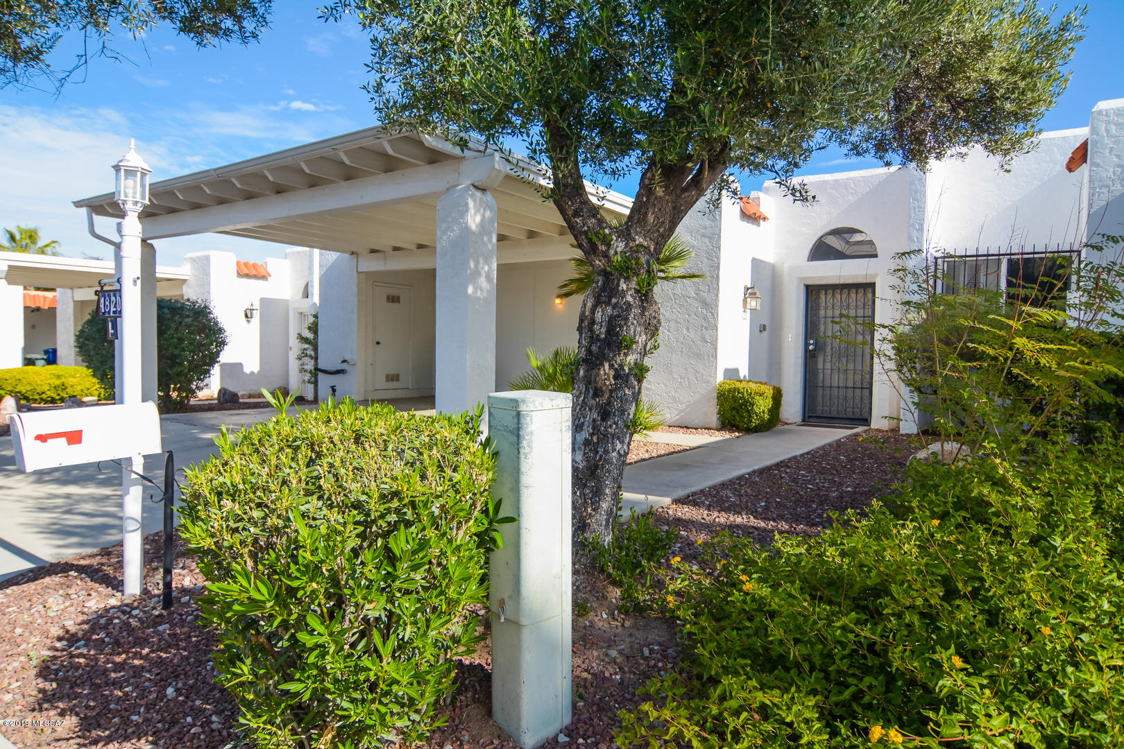 Beautifully remodeled Mediterranean Townhouse. Convenient Central Tucson Location. New rich laminate wood flooring. New modern kitchen with granite countertops and SS appliances. New earth tone interior paint. Upgraded carpet and padding in bedrooms. Dual closets in master bedroom. Light filled living areas. Large enclosed entryway. Covered back porch with mature vegetation. Updated light fixtures and hardware. Two car carport. Three exterior storage closets. Community features saltwater pool.