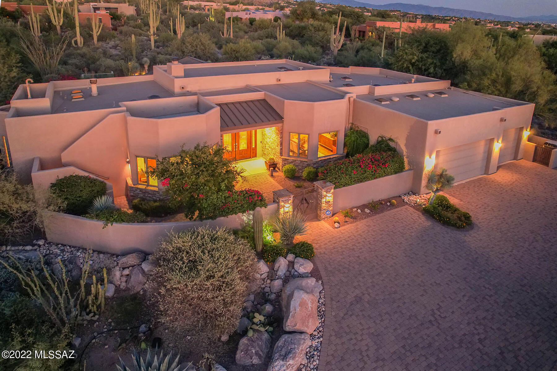 Located behind second gate in coveted Pima Canyon Estates. First time on  market in 16 years, features a stunning SW contemporary design that offers the utmost privacy & unobstructed views of Pima Canyon. Upon entering the residence, you are greeted with spacious great room w/stack stone FP  opening to  kitchen w/island/prep sink, cherry cabs & all SS appl. Step onto covered patio off family room to discover the joy of al fresco dining - set against mature vegetation, tranquil swimming pool/spa & built-in BBQ.
Retreat to primary suite  w/separate door to patio, oversized shower, FP & jetted tub. Two generous sized guest en-suites create the perfect space for hosting company. Den/office is conveniently adjacent to primary suite.  Enjoy stunning city  & mountain views from observation deck.