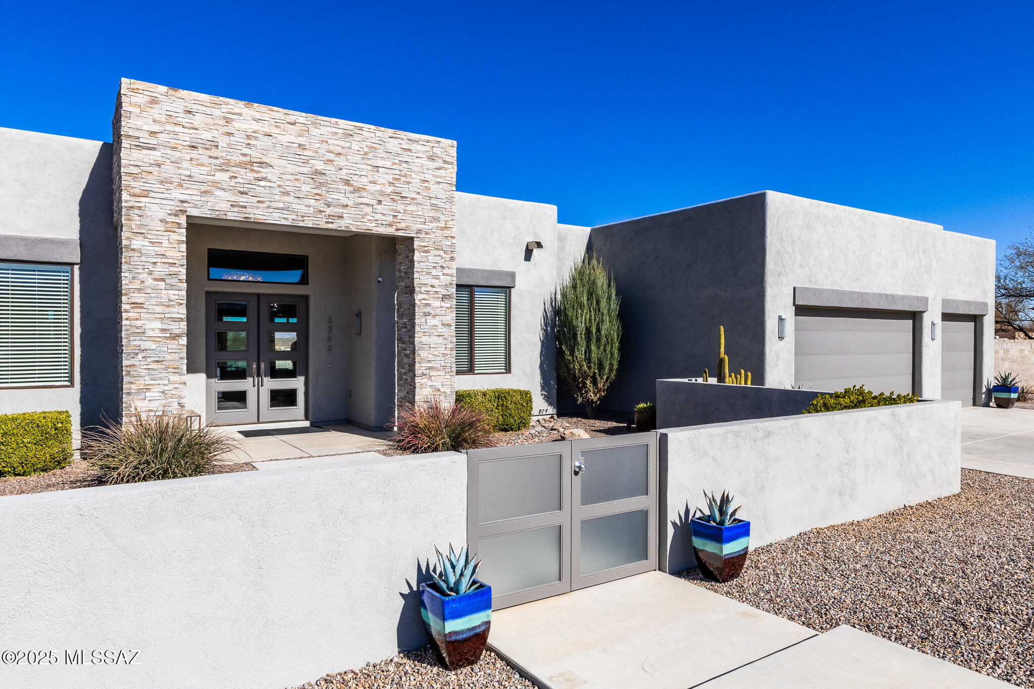 Escape to the luxury of this modern custom home on 3 private acres in the upscale Red Hawk at J-Six Ranch Subdivision 30 minutes east of Tucson & the Airport. Relax in the heated salt water pool, sit back in the 6 person spa, enjoy the sunset from the roof top deck or settle in and enjoy the view of the Rincon Mountains from the living room window wall with 12' ceilings.This one of a kind 3335 sf 3 bedroom 3 bath home has a designated office with built in desk system & Murphy Bed for extra guests & includes a fully enclosed heated & cooled AZ Room with 8' tall sliding glass doors that open to the back yard & pool area. There is an oversized 3 car garage w/ cabinets & a mini split + covered RV Parking with electric hookup. To top it all off this special home has an owned Solar System.