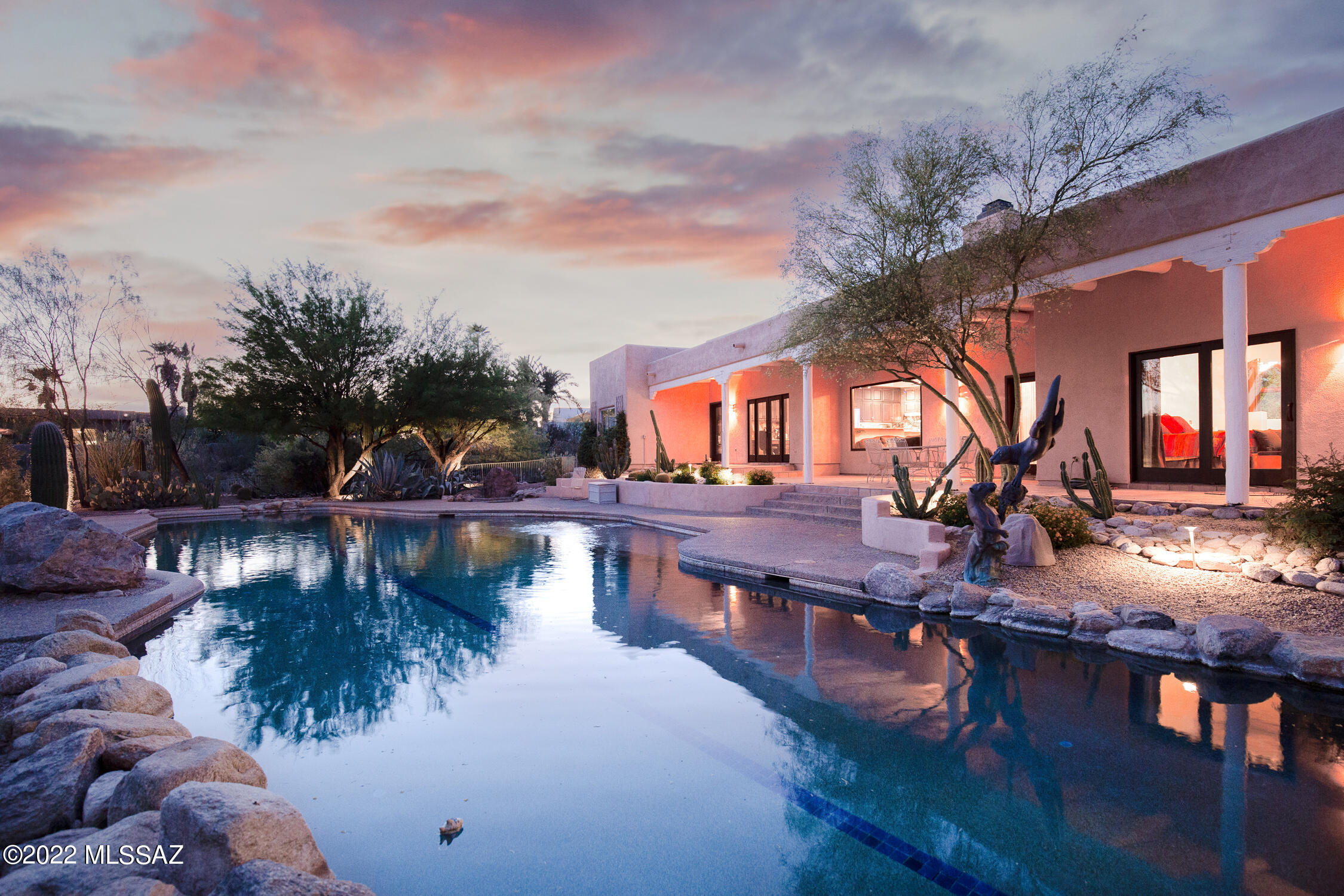 Southwest desert sanctuary with exceptional privacy, location, mountain and city views, located in the highly desirable Catalina Foothills Estates No 7. The privately gated oasis features 3162 SF in the main house, plus 221 SF heated and cooled Flex Space in the garage, currently used as a wellness room. The detached 618 SF studio was built in 2007, and can be used as an office, exercise room, media room or guest quarters (see floor plan). 

The incredible outdoor spaces include a 25 yard heated lap pool with a lounge ledge, spa, side yard with astroturf, mature citrus trees, and an extensive covered patio to enjoy city views.

Additional notable features include a 500 gallon in-wall marine aquarium, built-in humidifier system, Pella windows, updated kitchen and much more. Over $300,000 in updates and features throughout the years.  Detail of notable features and upgrades list available under documents. 

The strategic location offers the best of the foothills and the best of in town living, minutes away from both, with access from Campbell, River and First Avenue. 

Schedule your private showing.