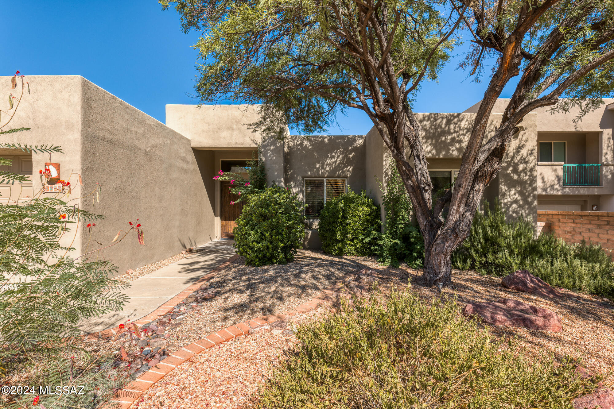 Nestled in the gated community of Fairfield Sabino Canyon, this beautiful home offers panoramic views of the majestic Catalina Mountains. Thoughtfully designed and crafted with masonry construction, this residence seamlessly blends contemporary design with Southwestern charm. Perched on a cul-de-sac above a wash, the home's unique position ensures unobstructed views. From the moment you step inside, a wall of expansive viewing windows greets you, perfectly framing the mountains. The natural light that floods the interior enhances the home's warm and welcoming atmosphere. The primary bedroom is a private sanctuary, with direct access to the patio, where you can start your day with breathtaking mountain vistas or unwind under the stars. The additional bedroom is generously sized, offering flexibility for guests or family, while a versatile office space provides a quiet haven for work, study, or relaxation.

This home is truly a unique blend of thoughtful design, quality craftsmanship, and the serenity of its surroundings. Whether you're seeking a tranquil getaway or an everyday escape, this property offers a rare opportunity to experience the beauty of Tucson living at its finest.