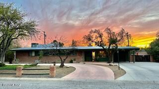 Mid century modern gem of a home in Historic San Raphael Estates. This burnt adobe home with 4 bedrooms, 2 full baths is on a large lot. Open space living areas, bringing soft light and natural elements into this homes. As you walk into 2,179 square ft. of living space you are greeted with a three-sided fireplace and open wood beamed ceilings. Kitchen contains upgraded appliances, fresh paint & accent lighting. Laundry area contains ample storage. Bedrooms with walk in closets. Large backyard with long porch for outdoor entertaining. Shed is also available for outdoor storage. One carport and circle drive for additional parking. RV Parking also available. Well maintained roof & upgraded electrical panel. HOA of $240. / yearly, allows use of private community pool.