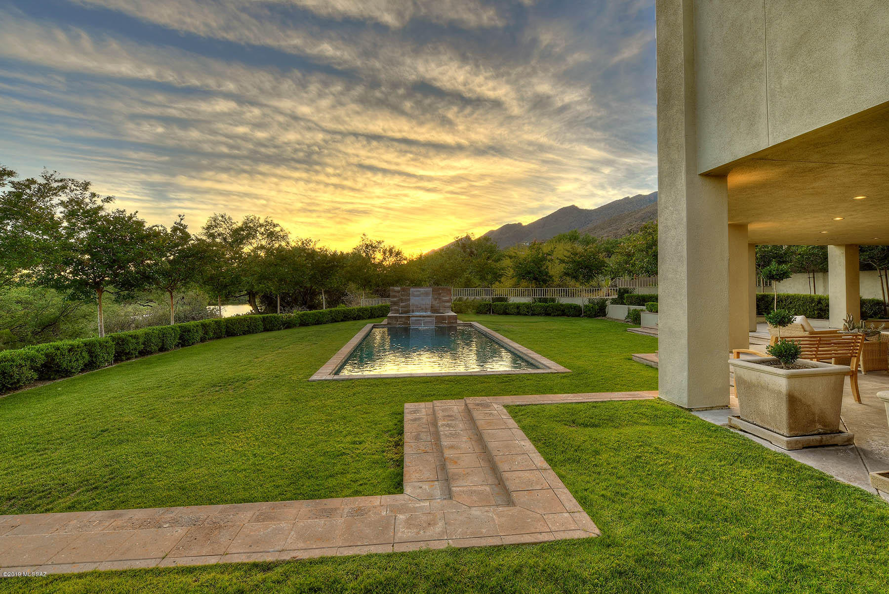 Masterful Design & Modern Luxury Are Uniquely Embodied in This 4 BR & 5 BA Ventana Canyon Residence Perfectly Sited Above The Golf Course & Lake Offering Dramatic Views From Every Room. Significant Recent Upgrades to The Home Include Brazilian Redwood Floors, Glass Front Entry, Great Room Stone Fireplace & Mantel, 1200 Bottle Walk in Wine Cellar, Exquisite Marble Master Bathroom, Marble Laundry Room, Lush Landscaping, 2 of 4 HVAC's, Full Roof Replacement, Motorized Window Coverings, & Interior + Exterior Painting. Other Fine Features Include a Stainless Kitchen w/Neff Cabinetry, Quartz Counters & Wolf + Sub-Zero Appliances. Captivating Great Room w/ 20 Foot High Ceilings Allowing an Abundance of Natural Light, Formal Dining Room & Bar, Devine Master Suite w/ Fireplace & Balcony, 3 Guest En Suites w/ Walk In Closets, Private Outdoor Living Area w/ Deep Covered Patios, Teak & Granite Outdoor Kitchen w/ BBQ, Dramatic Pool & Spa, & Stellar Views!! This is a one-of-a-kind home with a style that is not often seen in the Tucson market.