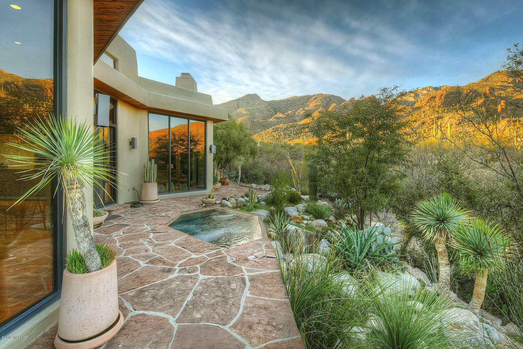 Tucked Away on a 2+ Acre Lot In The Back of Guard Gated Finisterra Sits This  4 BR & 4 BA  4,222  SqFt Private Retreat - Close to Everything, But Away From It All.  A Stylish Recent Remodel Includes - Open Floor Plan w/ Floor to Ceiling Windows, State of the Art White Kitchen w/Stainless Viking & Dacor Appliances & Quartz Counters, First Floor Master Suite w/ Spa Like Bath w/ Marble Counters & Walk In Shower w/ Separate Tub + Custom Built Out Walk In Closet, 3 Newer HVAC's, & Whole House Re-Plumb. 4th Bedroom + Bath is on Upper Level and Could be Used As Office/Gym. Other Fine Features Include Wood Floors Throughout, Vaulted Wood Plank Ceilings, Guest Rooms w/Walk in Closets, 3 Car Garage, & Commanding Canyon & Mountain Views!! Outstanding Community Club House w/ Pool, Spa, & Tennis Courts