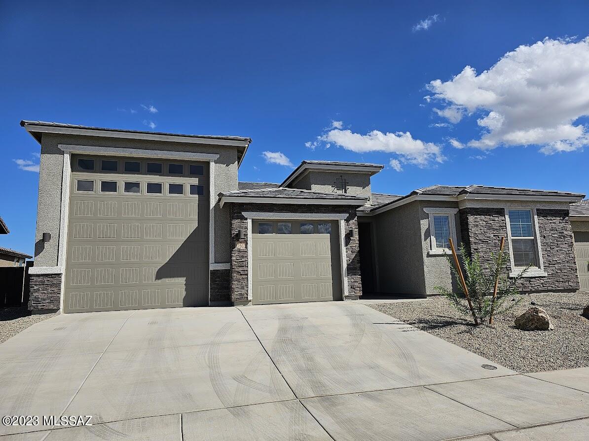 Home is SPECTACULARLY MAGNIFICENT! Never lived in! Includes so many things in addition to the oversized ultra RV garage on one side including a 14-50 outlet for your electric car charging station. Also includes: a 3-car tandem garage, utility sink, water softener, a garage service door. Gorgeous mountain views from backyard sporting view fencing to maximize your enjoyment and plumbed for gas grill.  Huge open great room, ceiling fans throughout. Great mud room with storage. Kitchen has massive island, walk-in pantry; double ovens; micro; gas, 5-burner range. Split 4 bedrooms from Master suite includes: oversized walk-in shower; huge walk-in closet; double sinks; door to the patio.  Laundry room with washer/dryer/utility sink and cabinets! Pets upon approval.
