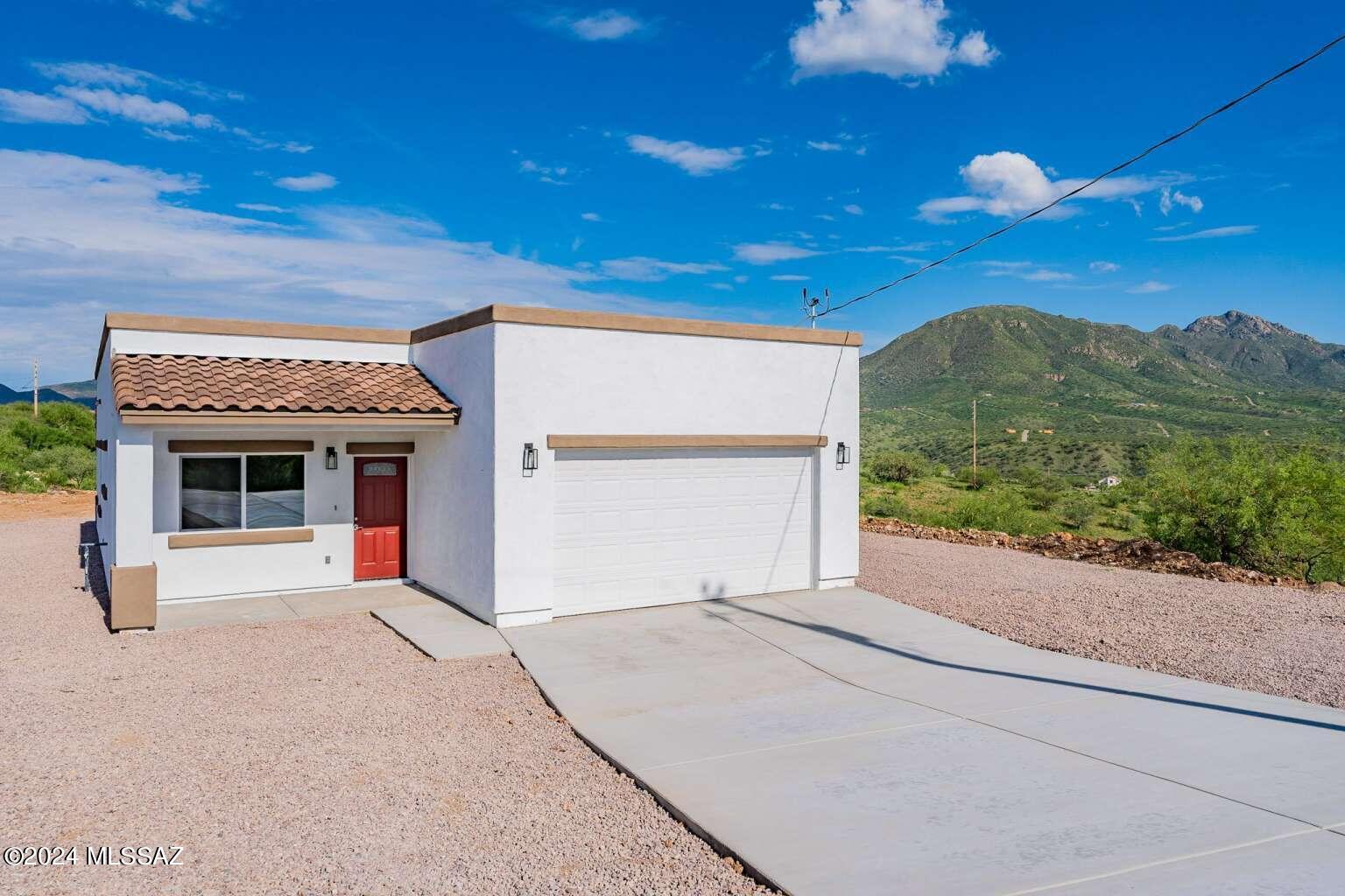Come see this beautiful home with Mountain views! A newly built 3 bedroom 2 bathroom home with 1388 sq ft. Open concept home with a 2 car garage. You will fall in love with this 2 tone cabinetry in kitchen with new energy efficient stainless steel appliances and quartz countertops. The entire home and bathrooms are tiled. The main living room and kitchen have a herringbone tile pattern. The back has a covered patio and the yard is a blank canvas to use your imagination and create the backyard of your dreams to enjoy your beautiful views. Both bathrooms have waterfall shower heads and all bedrooms have spacious closets and large ceiling fans. Come see this Unique home before its too late!