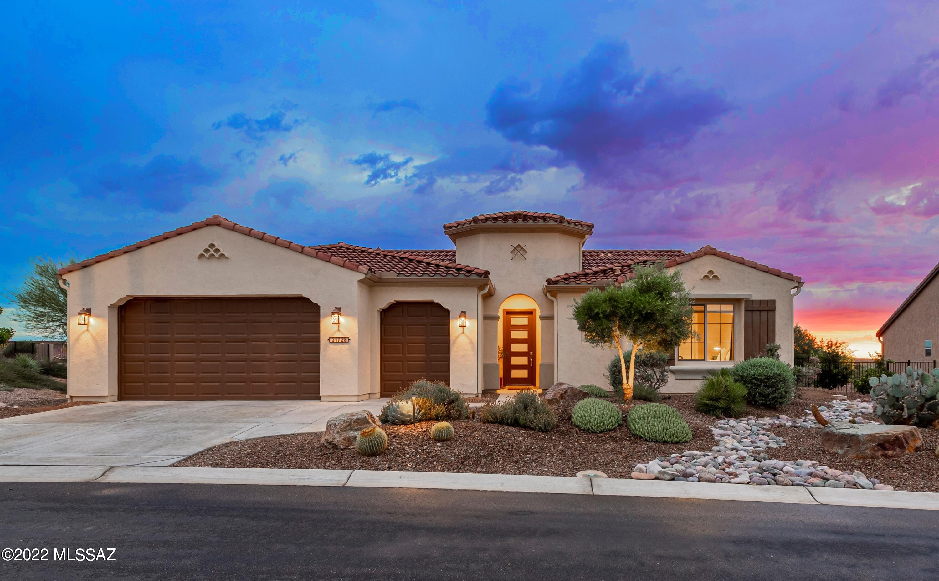 Why wait months when you can move into this beautifully upgraded Tesoro model today?! Relax on your spacious pavered patio w/generous lighted pergola for added space & enjoyment. A premium built in BBQ & countertop pizza oven add hospitality. Two raised beds for plantings! Inside the Great Room features custom stacked stone TV alcove w/electric fireplace & adjacent dry bar/buffet w/wine cooler for easy entertaining. Kitchen features an electric combination convection oven, subway tile backsplash, butler's pantry w/floating shelves, walk in pantry closet. Granite countertops, pendant lights, Blanco sink.  Honeycomb dual direction shades & elegant window treatments, walk in closets, generous closet storage, upper and lower cabinets in the laundry. Walk to wonderful resort style amenities!