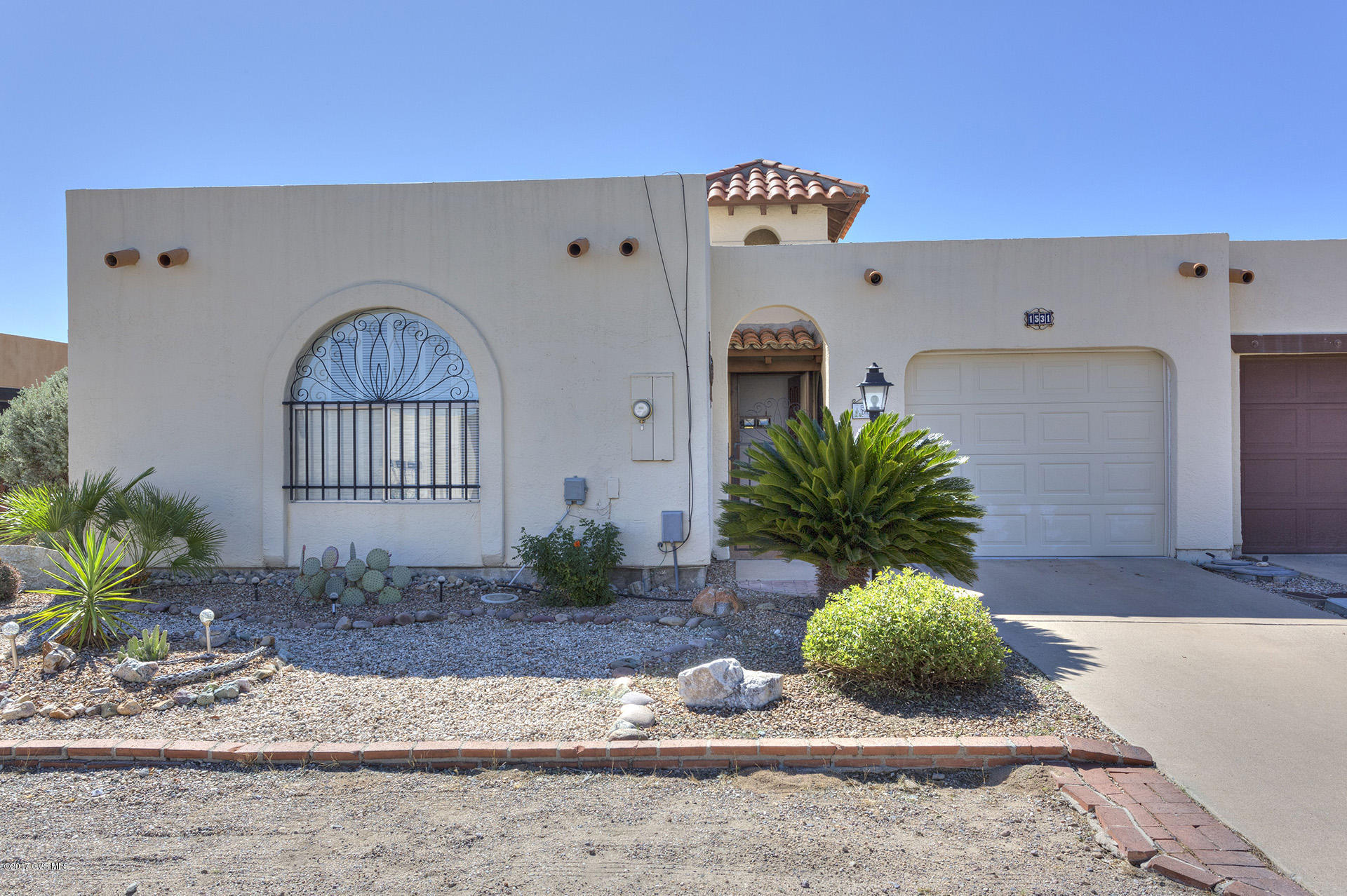 Well-maintained hacienda style townhouse. Fully furnished-all you have to do is bring your clothes and toothbrush-this home is move-in ready. Located near several GVR rec centers and golf courses you will enjoy SW living at it's best. 2 large bedrooms with lots of closet/storage space, freshly painted doors and trim, undated bathroom vanities, roof recoated with 3 year warranty, termite warranty, tile in all the right places, large enclosed AZ room, and extended ramada (recently painted) over back patio are but a few of the amenities that make this home perfect for year-round living or your own winter retreat. Please put this on your ''must see'' list - you will not be disappointed.